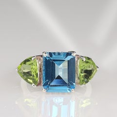 AJD Dinner Ring Featuring Blue Topaz and Green Peridot