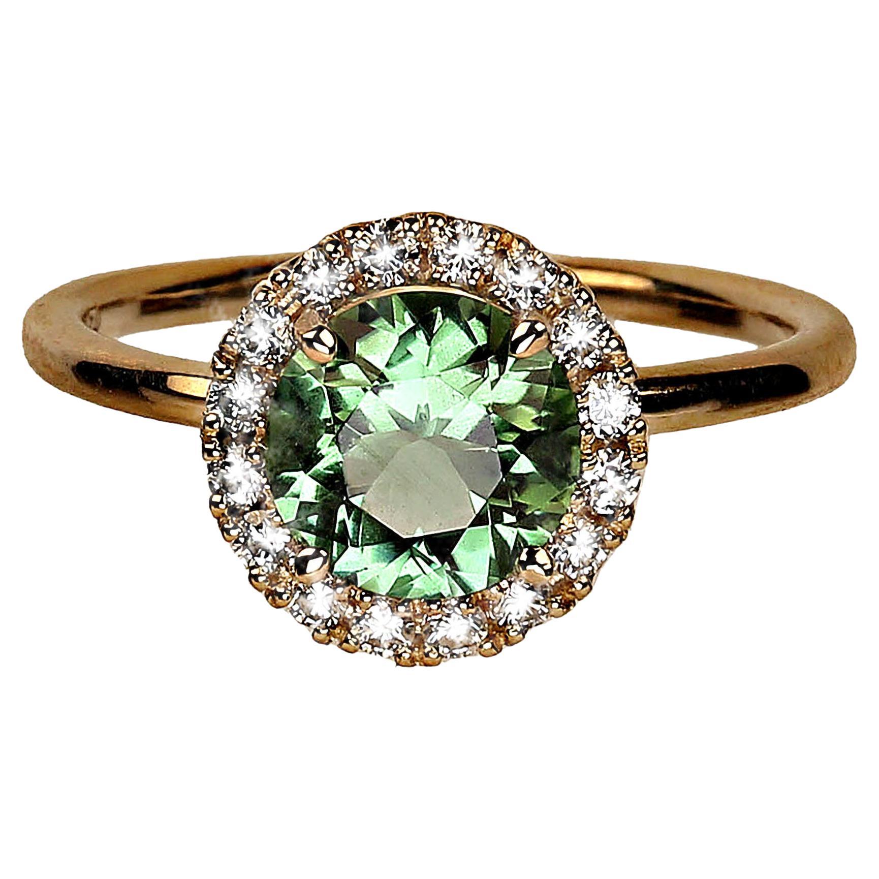 Gorgeous Ring to wear every day.  This beautiful round Brazilian green Tourmaline, 1.2ct,  has come out of the vault after 30 years. It is set in a diamond halo of 0.30ct to complement its distinctive Brazilian green with just a hint of blue color. 