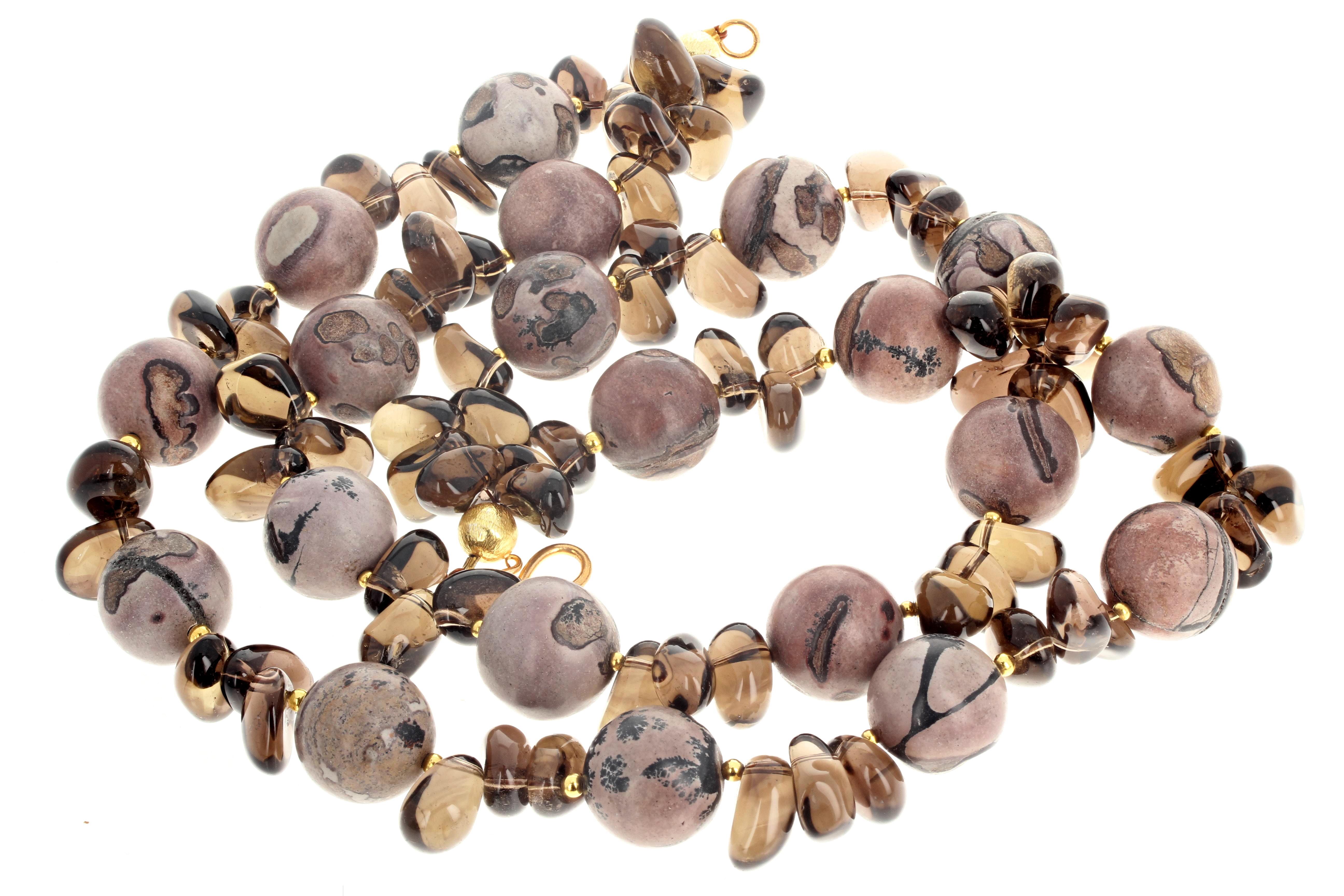 This magnificent double strand of natural highly polished dramatic slightly pinky toned Jasper enhanced with natural real highly polished Smoky Quartz is 17 inches long.  The round polished Jaspers are approximately 18mm and the polished Smoky