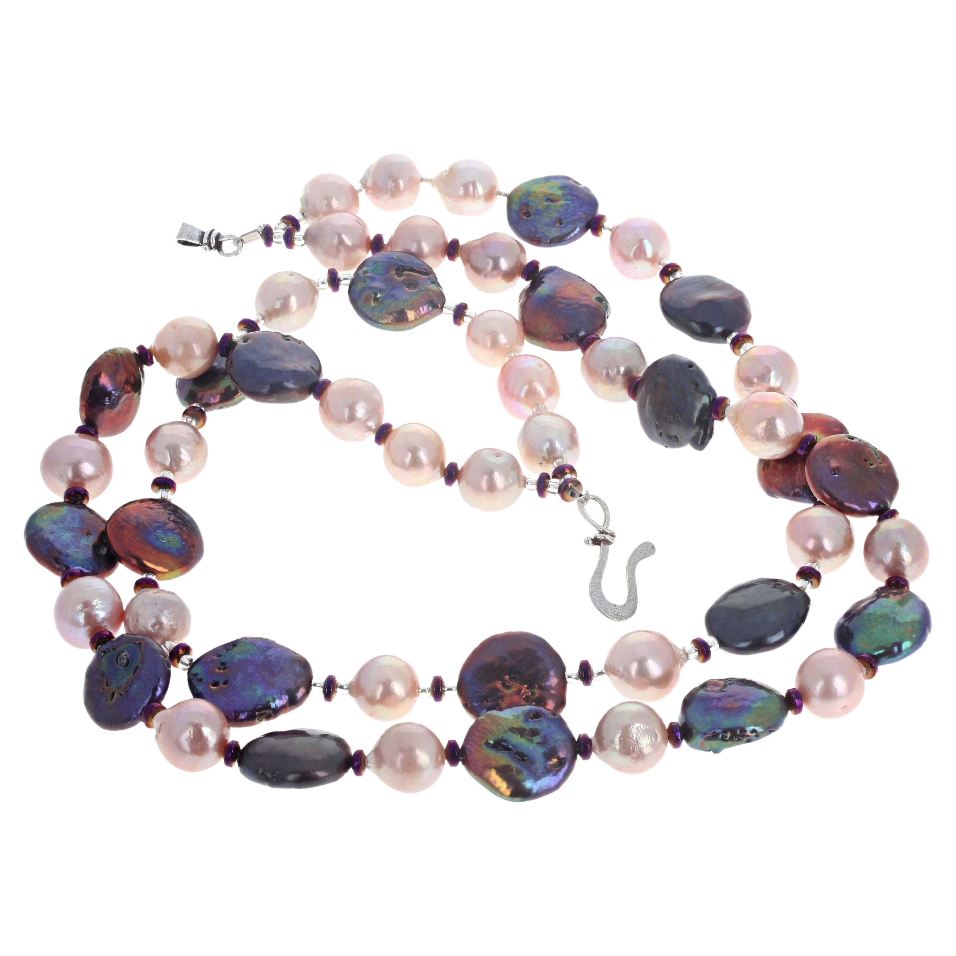 Fascinating double strand of light pinkish cultured real Pearls (approximately 10mm) enhance these fascinating real cultured Keshi Pearls (approximately 16mm) enhanced also by the teeny tiny little real purple Amethysts.  This 19 inch long necklace