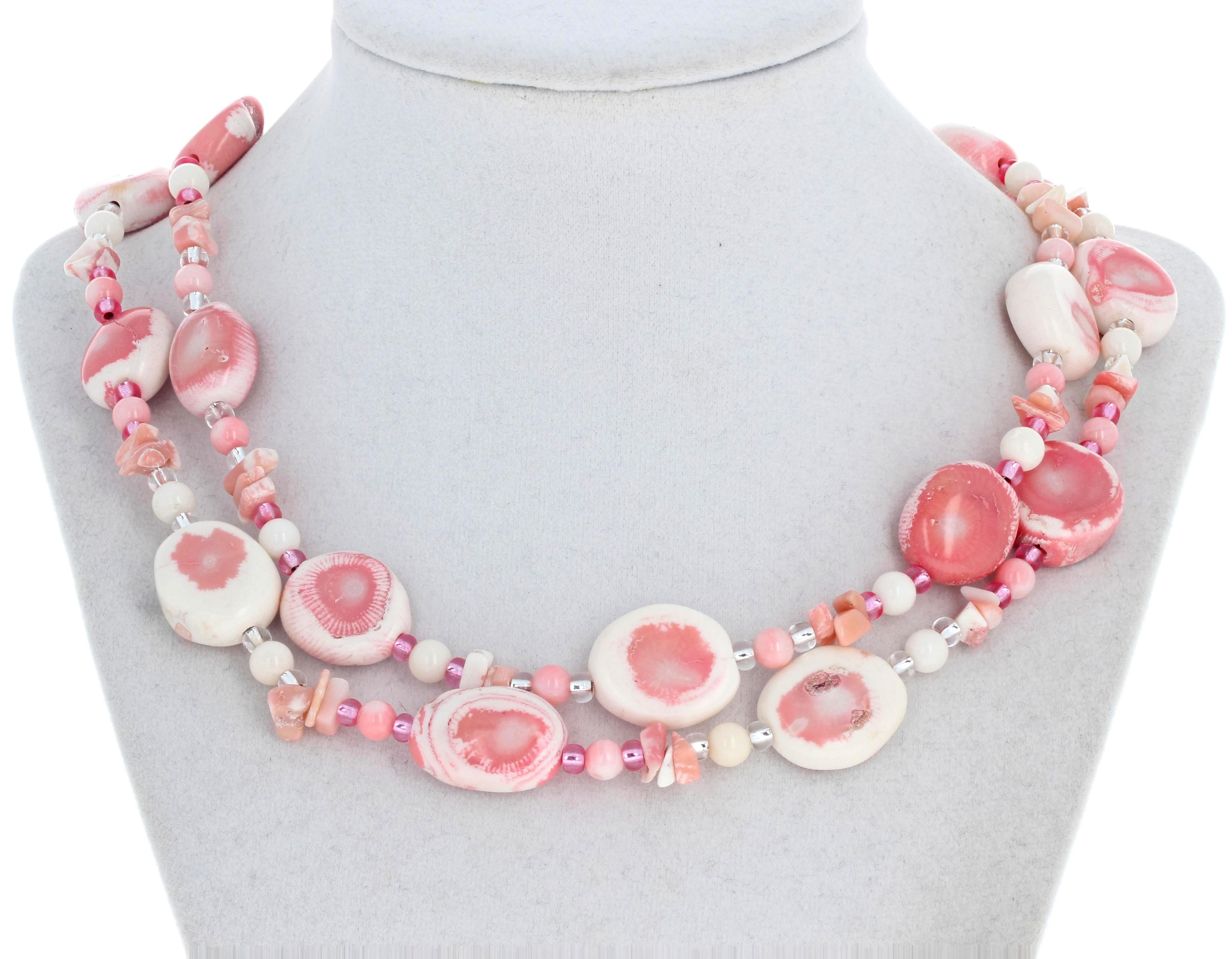 This beautiful double impressive strand of pinky creamy white natural Coral is 17 1/2 inches long.  The largest are approximately 19mm x 18mm.  They are enhanced by little round pinky creamy white rondels - approximately 6mm - and tiny little color