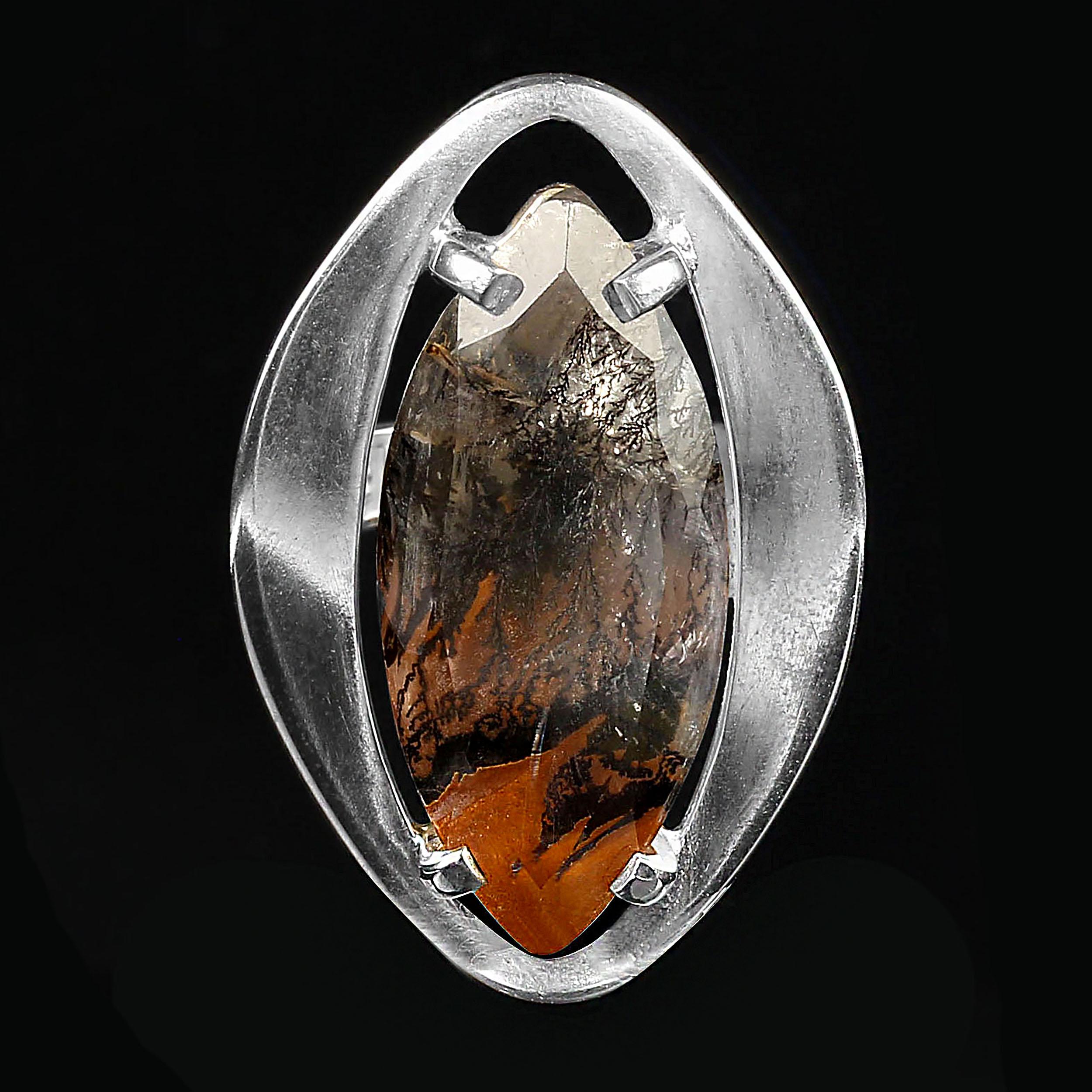 Dramatic Dendritic Quartz ring with orange and black features.  This unusual marquise shaped gemstone is approximately 13 carats. This one-of-a-kind gemstone is set in a custom-made sterling silver ring perfectly created to best display the