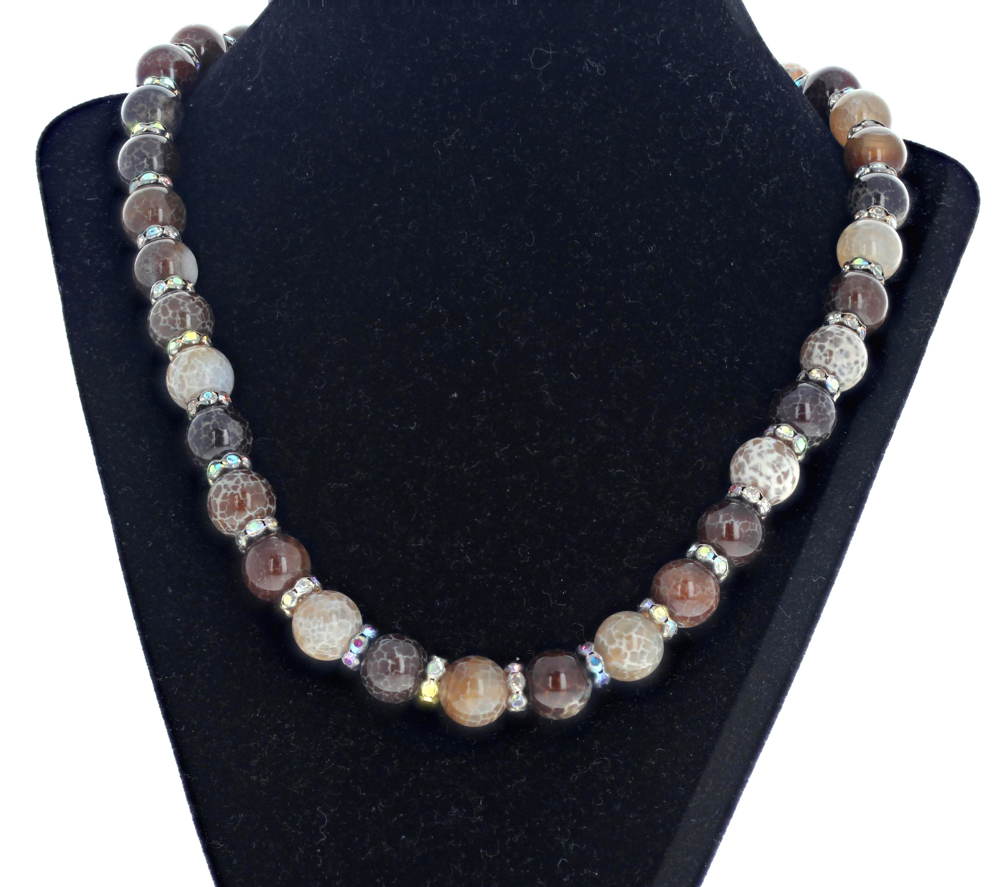 This 20 inch long necklace of Natural Agates is enhanced with sparkling spacers that intensify the beauty of the Agates.  The highly polished Agates are approximately 12mm.  The clasp is an easy to us silvery Toggle clasp.  
