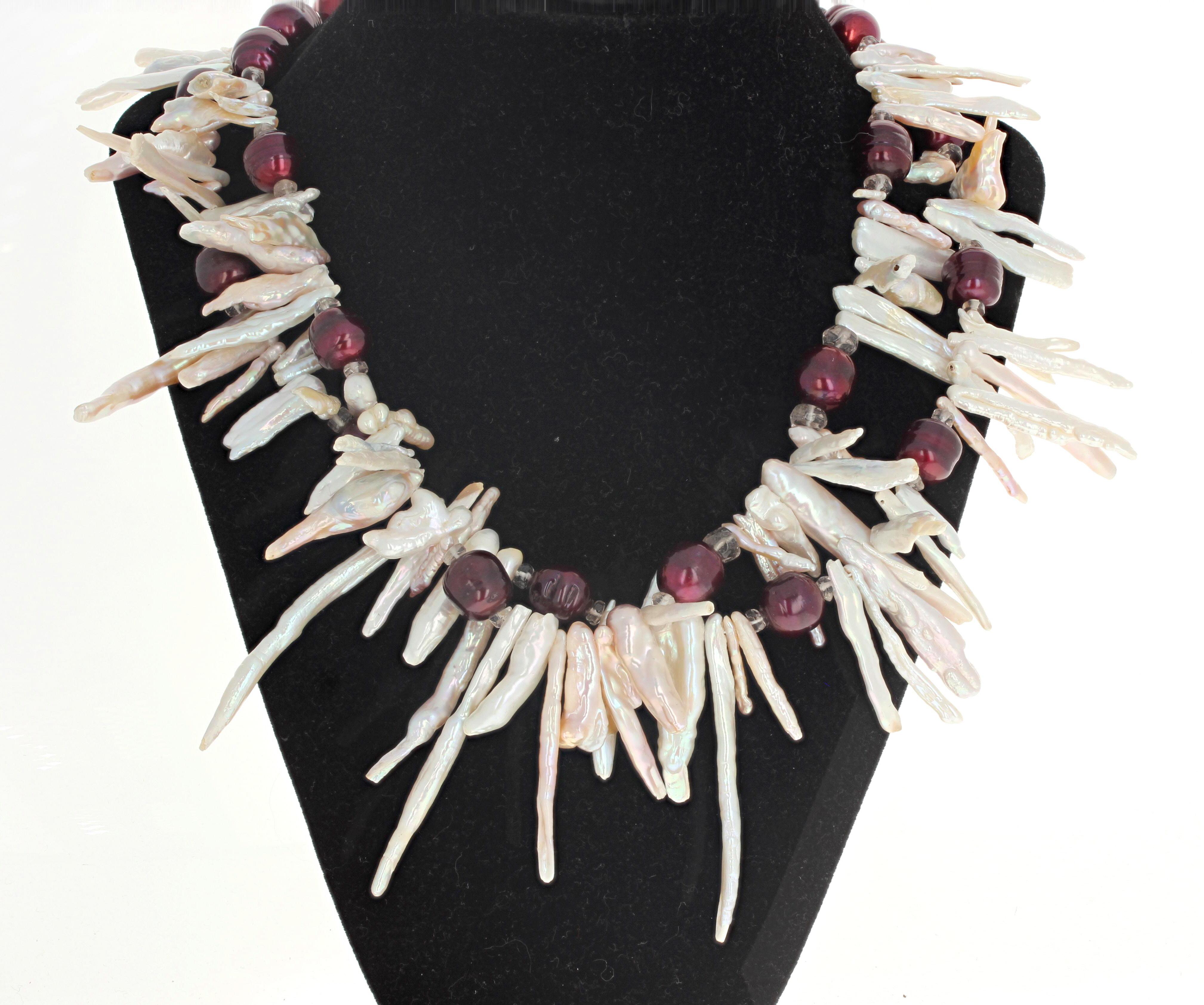 This double strand of really dramatic necklace is 18 inches long. It is natural real white Pearl leaves enhanced with round burgundy color real cultured Pearls.  The longest 