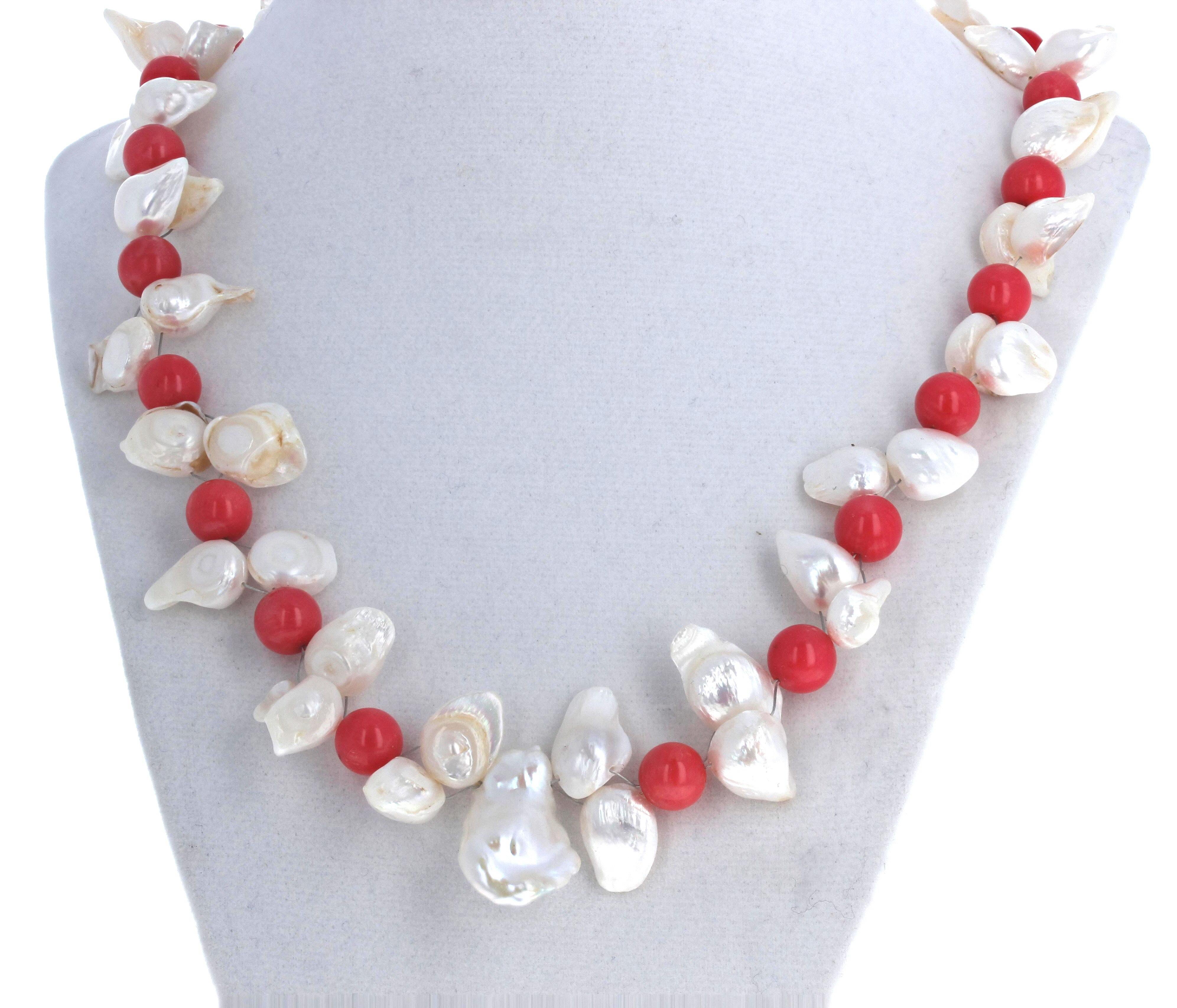This fascinating flippy floppy white Pearls (approximately 24mm x 15mm) enhance these fascinating Italian orangy round highly polished Corals.  This is 21 inches long and the clasp is an easy to use gold plated hook clasp.  