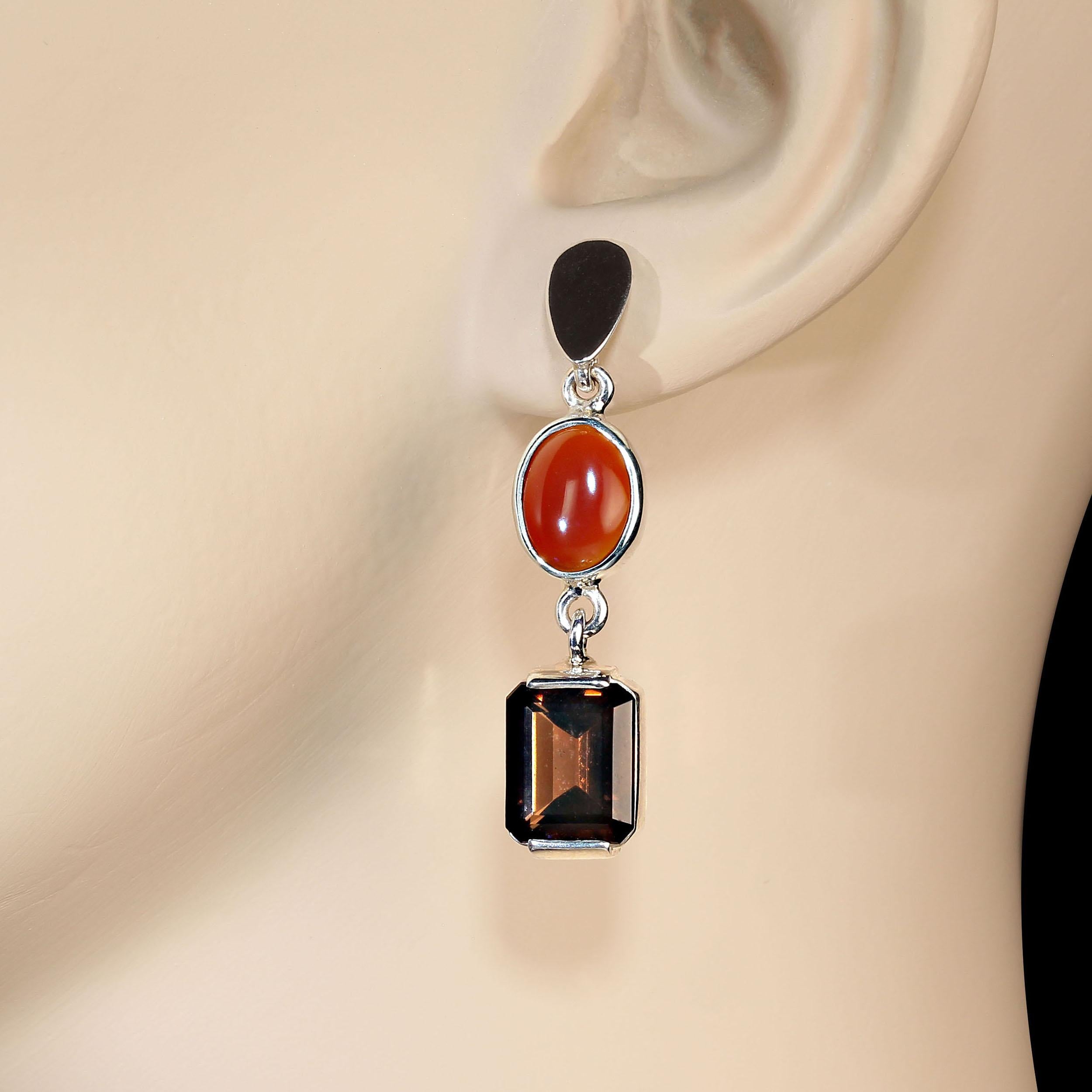 Elegant dangle earrings of sparkling orange Carnelian and warm Smoky Quartz. These lovley gemstones come straight from one of our favorite vendors in the heart of Brazil.  They hang 1.5 inches in length and have a post and butterfly back.  The