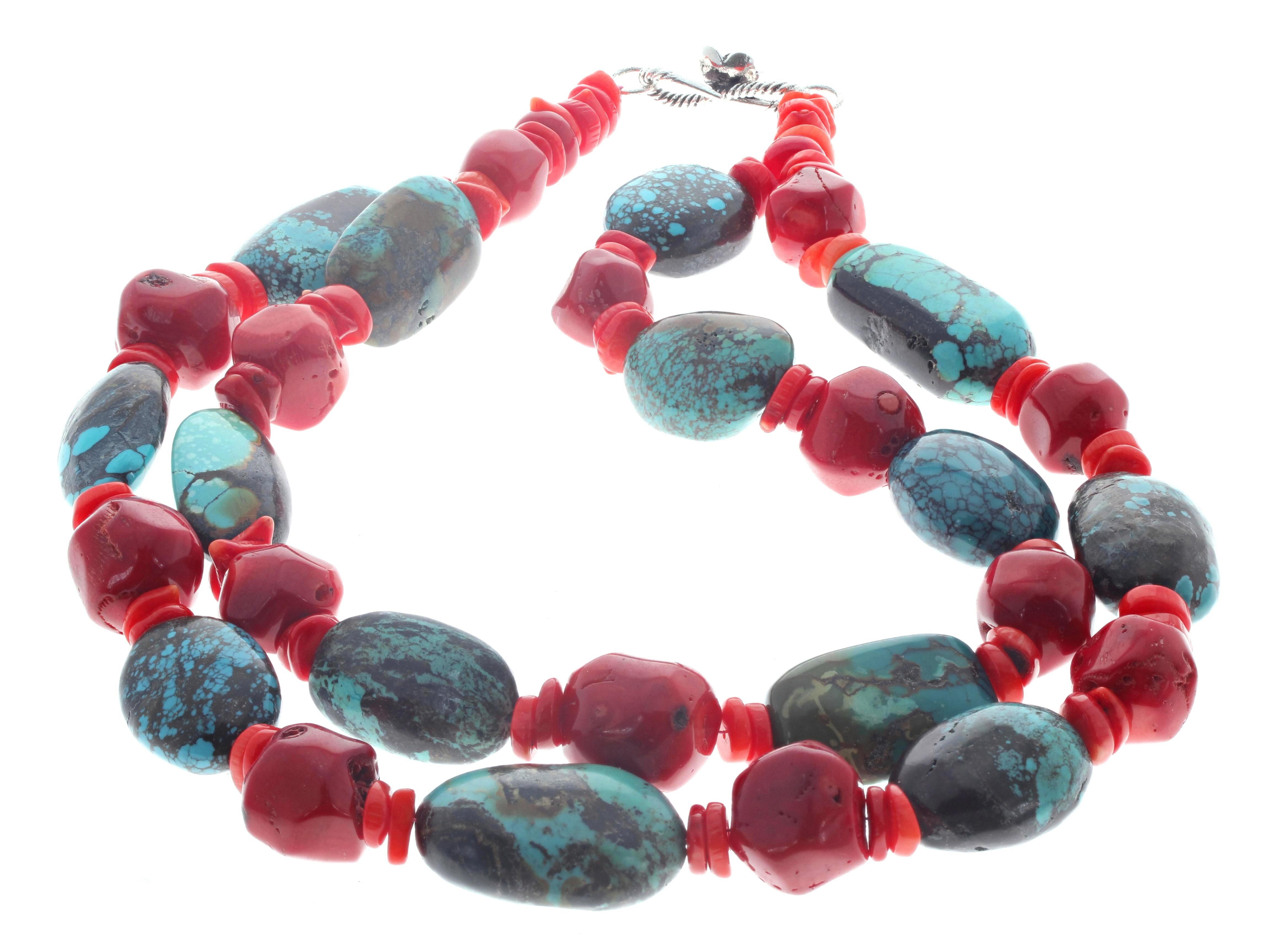 This double strand of natural Turquoise and natural Coral necklace is 17 1/2 inches long.  The largest Coral is approximately 17mm x 17mm.  The largest Turquoise is approximately  31mm x 19mm.  The clasp is an easy to use sterling silver clasp. 