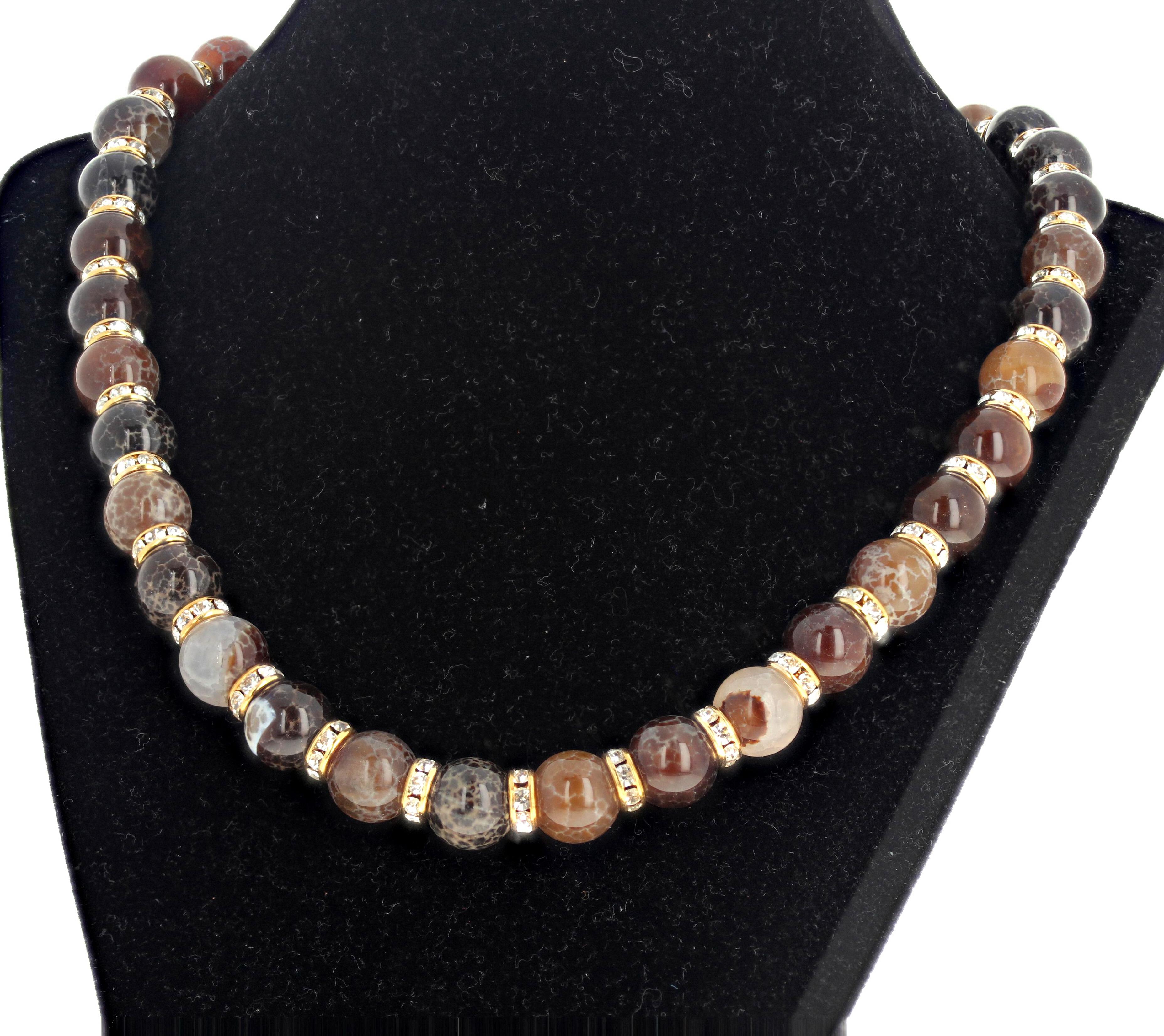 These beautiful natural Agates of different colors are approximately 12mm to 13mm round and highly polished so they glow and sparkle.  They are enhanced with goldy sparkling rondels.  This necklace is 20 inches long and the clasp is an easy to use