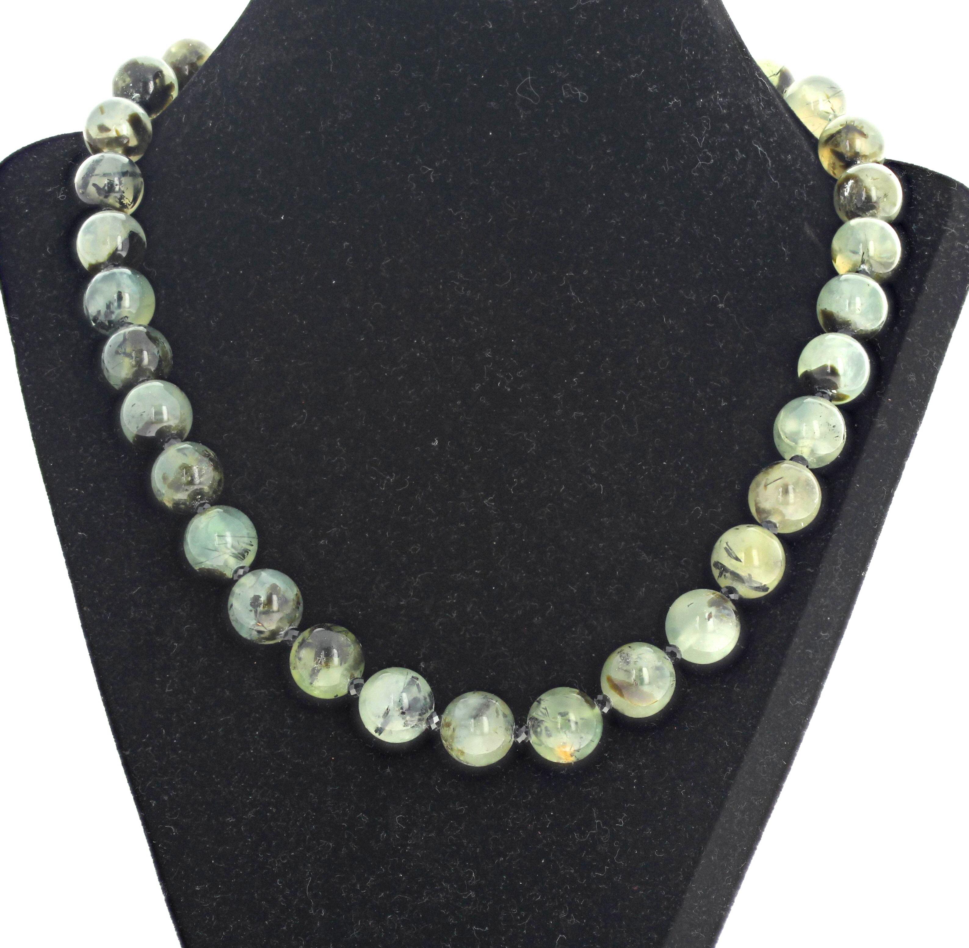 This brilliant highly polished natural Prehnite (approximately 12mm) are enhanced with sparkling gorgeous natural black Onyx gemstones.  This is 19 inches long.  The clasp is a gold plated easy to use hook clasp.  This is quite dramatic around your