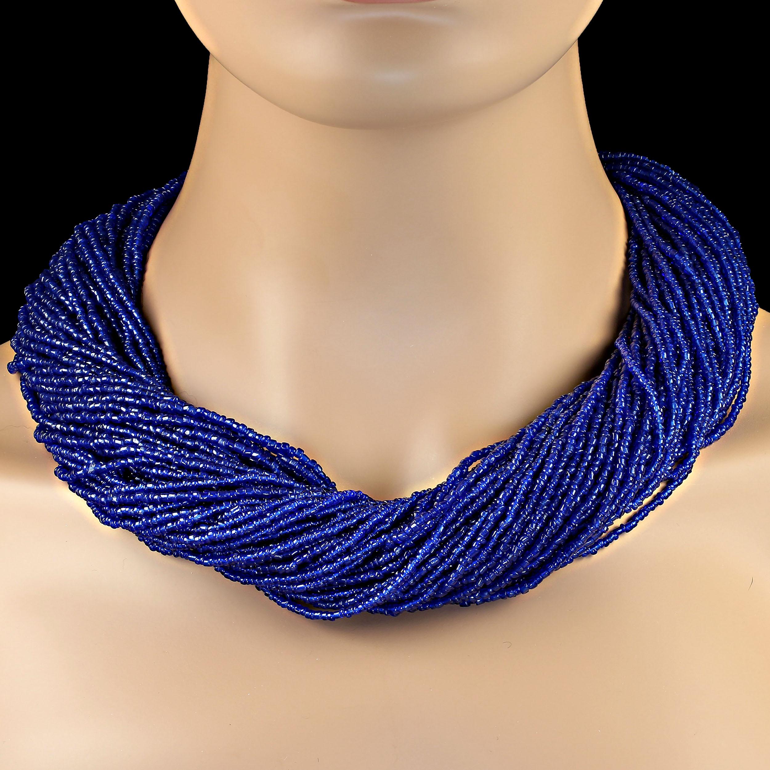 Multi-strand, bright blue seed bead necklace.  This lovely necklace can be worn either twisted or gently one strand on top of each other.  At 22 inches, it will sit at your neck or just below depending on your preference.  MN2305