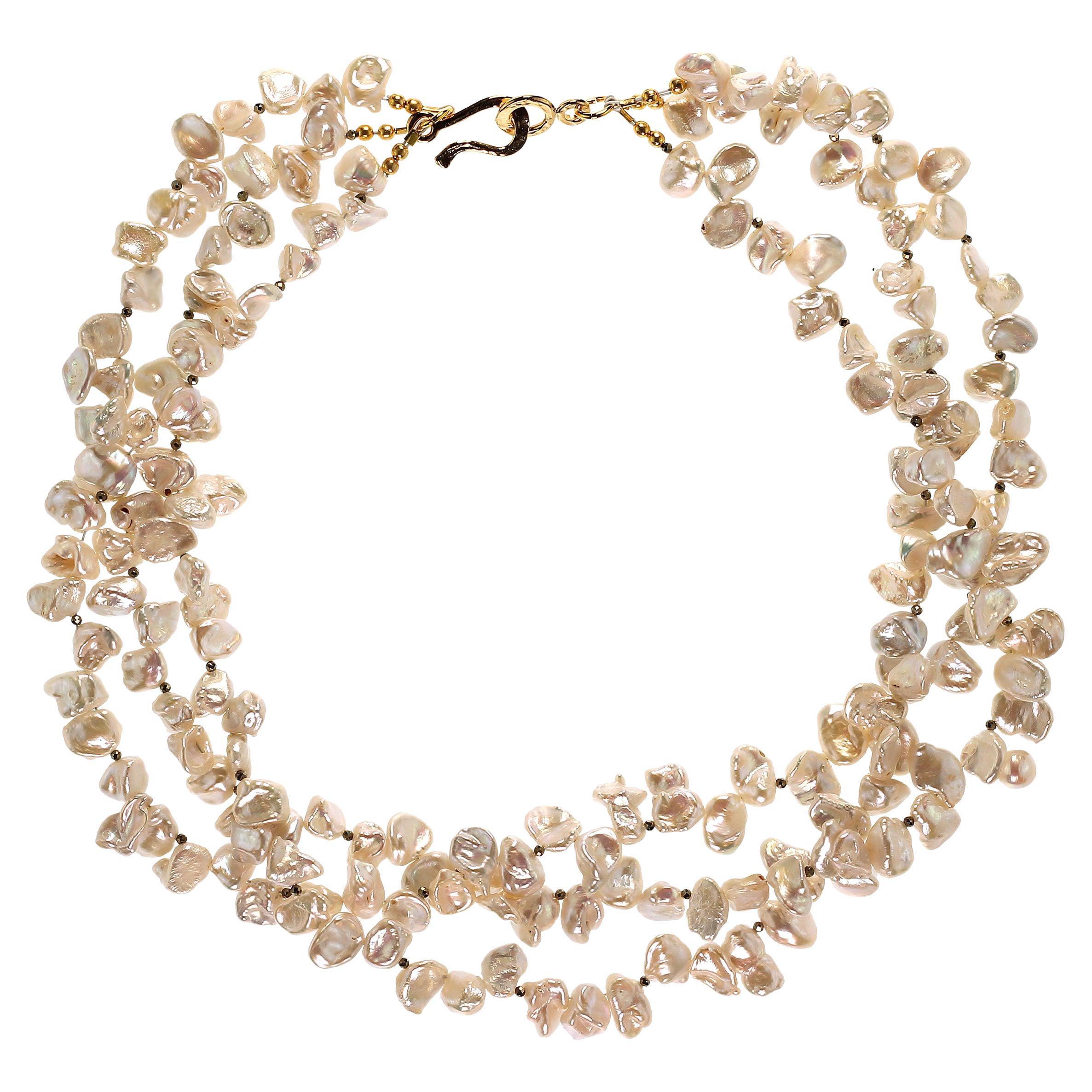 Own the pearls you deserve

Luscious three strand necklace of iridescent white Biwa Pearls with Pyrite accents. This versatile 19 inch necklace can be worn flat or twisted for a shorter look. The faceted Pyrite add a bit of sass and sparkle to this