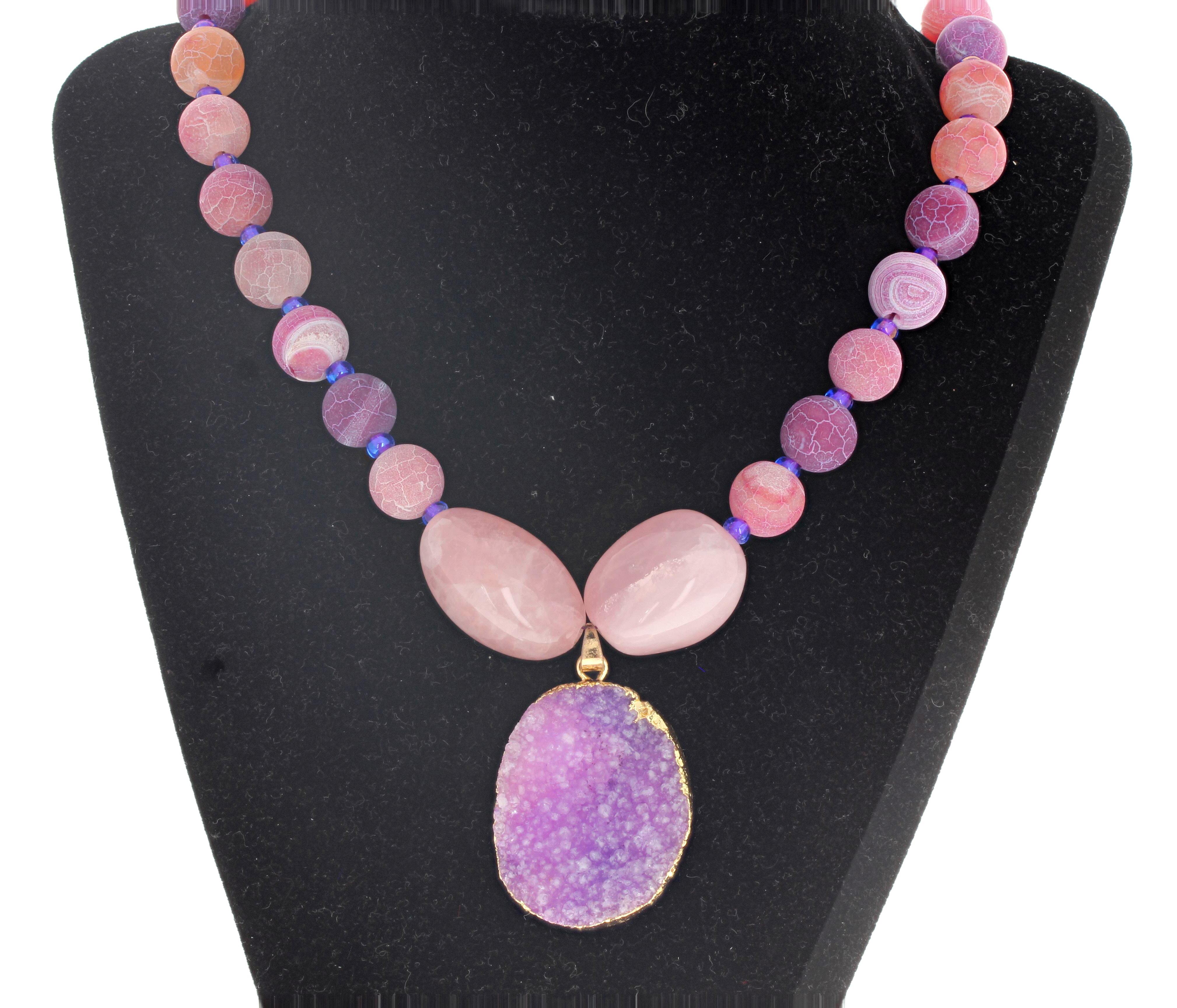 Beautiful highly polished round natural multi-colors Druzy Quartz with the two natural polished center Pink Quartz are enhanced by the large natural purplypink center dangling partially gold plated Druzy Quartz.  This necklace is 20 inches long. 