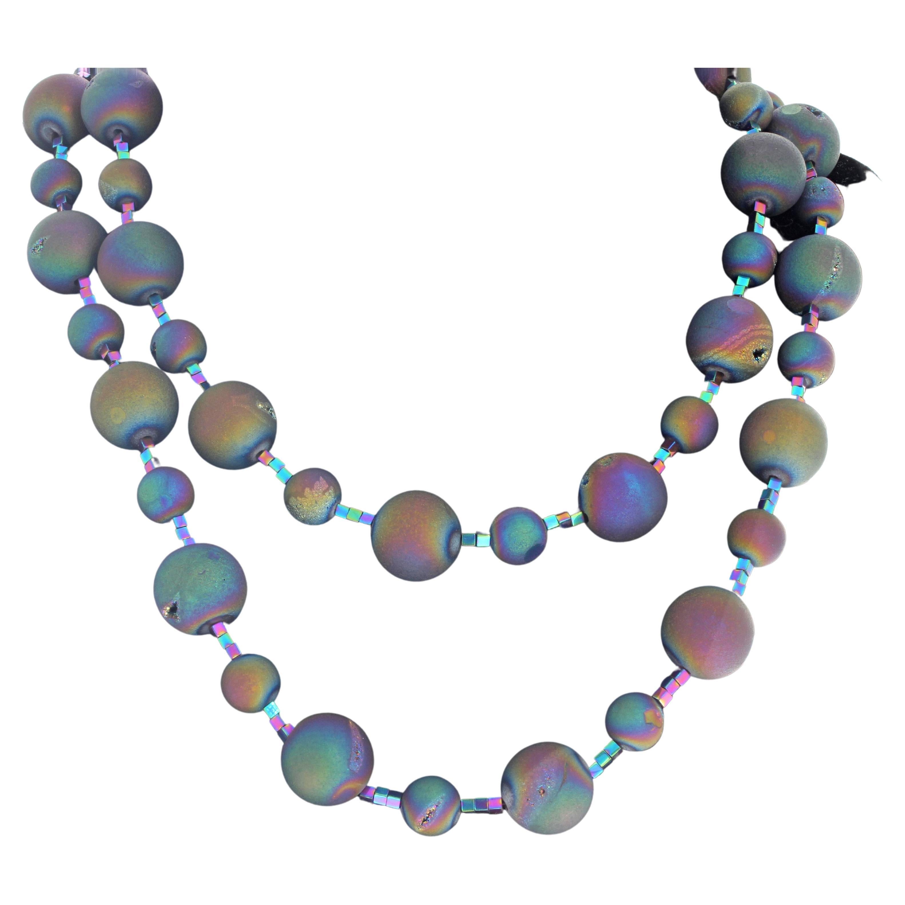This 40 inches long necklace is absolutely fascinating !  The multi colors of these highly polished round Druzy Quartz rocks are all different.  The large ones are approximately 17mm and the smaller ones approximately 11mm.  They have little snicks