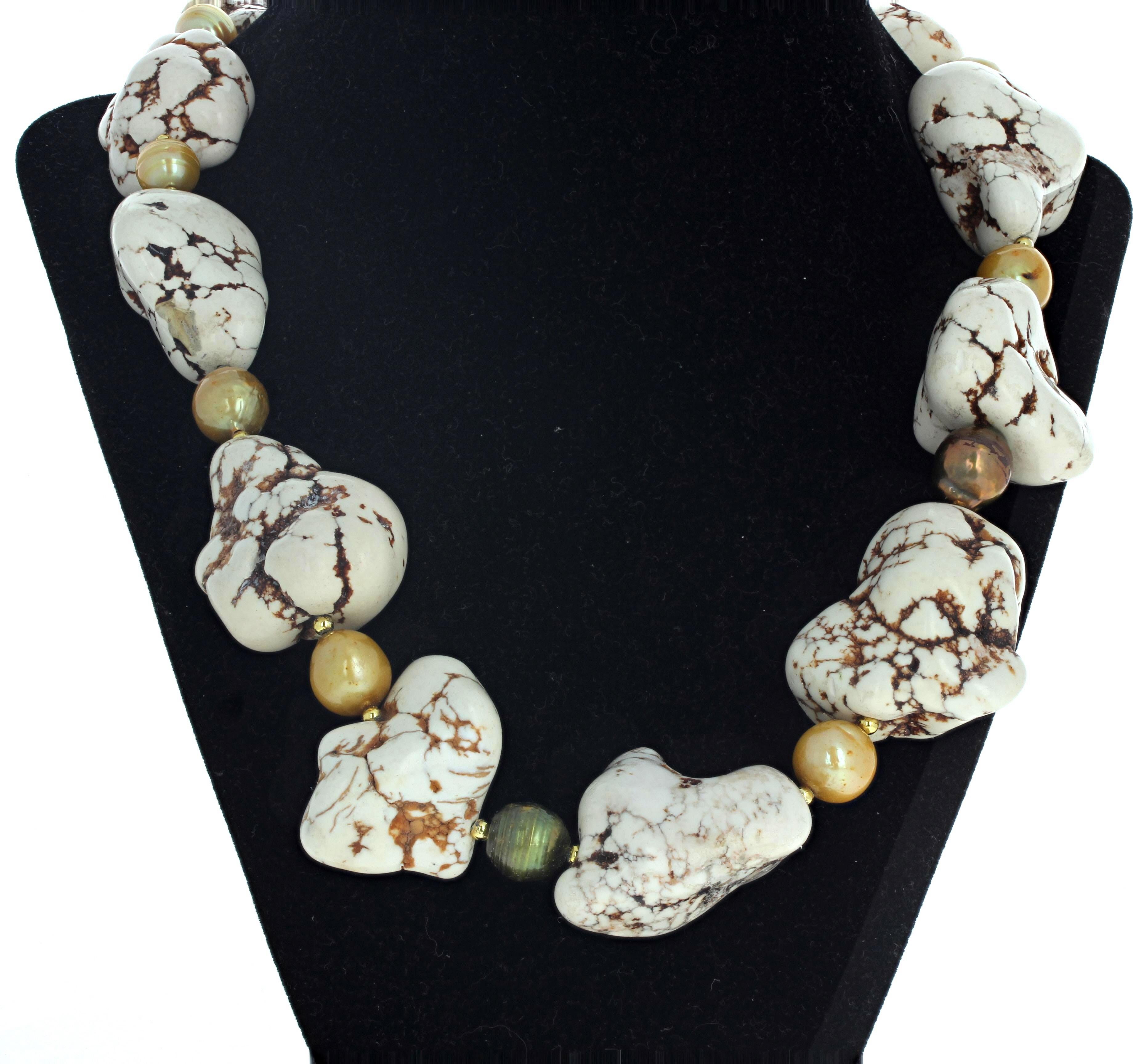 Known as Howlite Crystal Beads - Creamy White Brown Vein Beads - these are polished so they sit comfortably and artistically around your neck in the 21 inch long necklace.  The largest one is approximately 40mm x 35mm.  They are enhanced with lovely