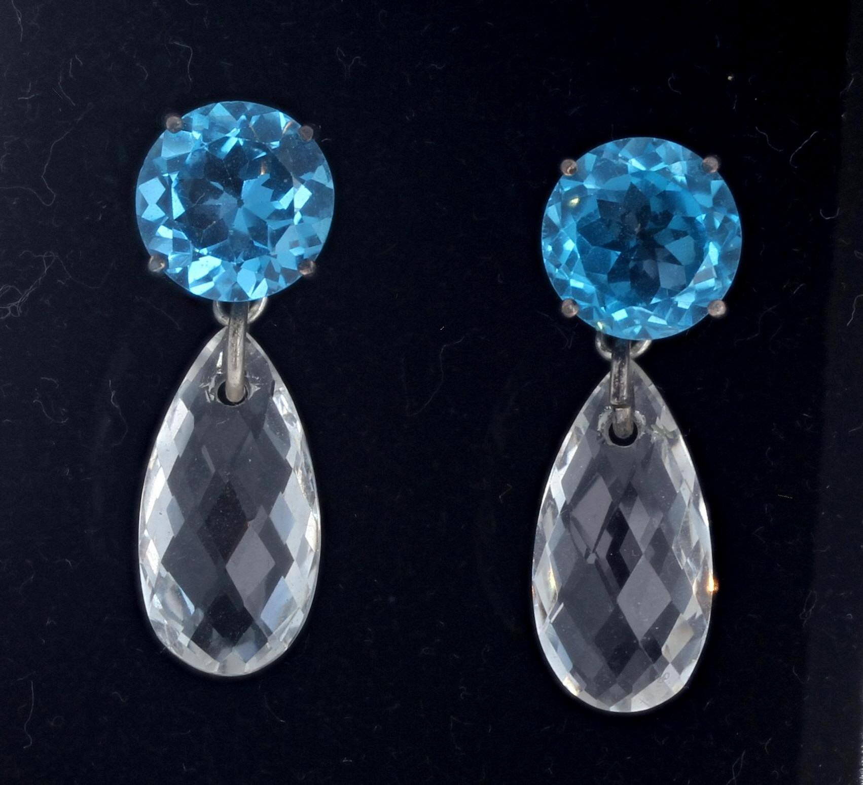 These intensely big Blue Topaz (11.5 carats total) - 11 mm - dangle the brilliant gem cut Clear Translucent Topaz - 19mm x 10mm - in these wonderful fun stud earrings.  They are set in sterling silver.  
