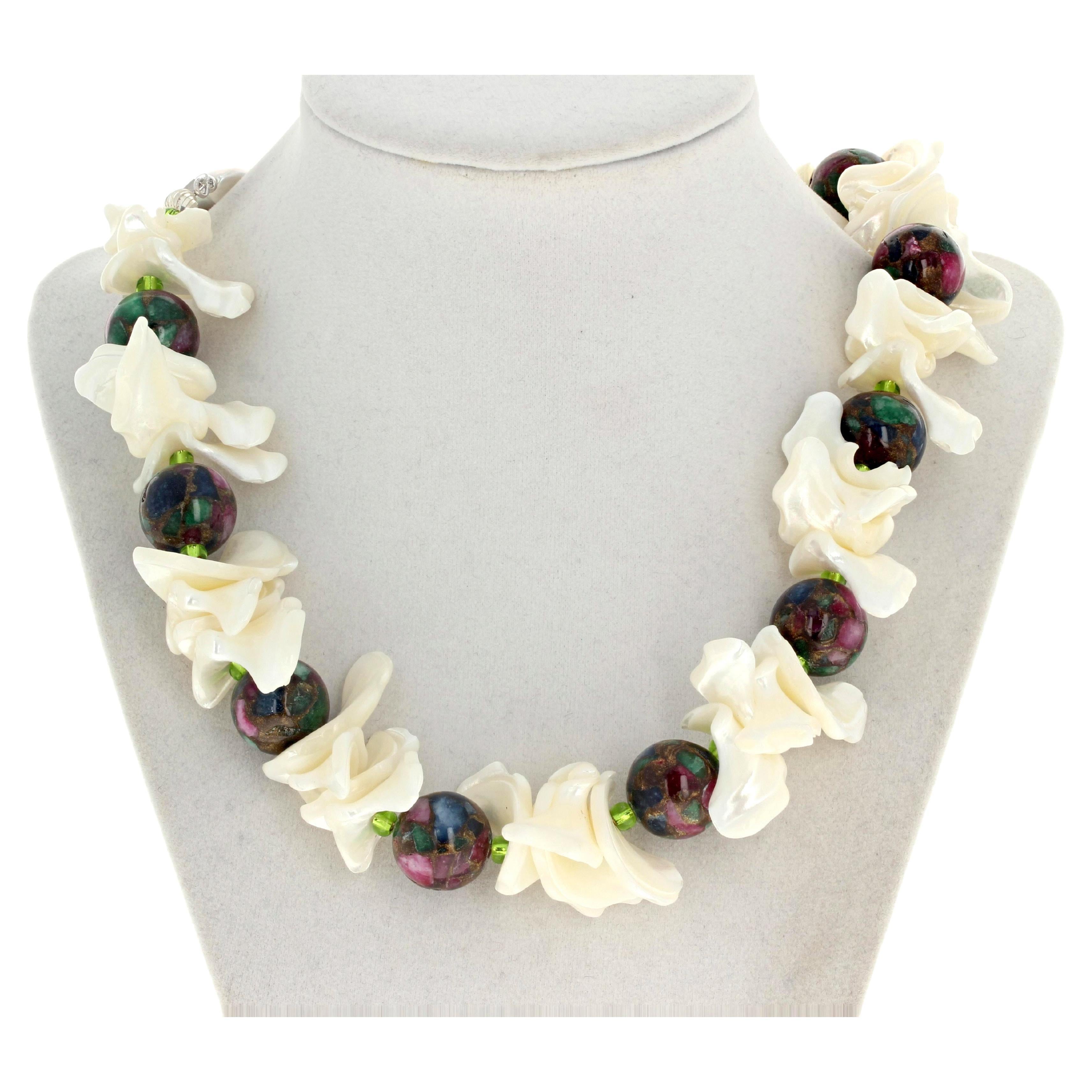 This multi-color natural Ruby Zoisite glows magnificently between these beautiful highly polished (no sharp edges) white Pearl shells in this 19 inch long necklace.  The Ruby Zoisites are approximately 18mm.  The clasp is a silver easy to use hook