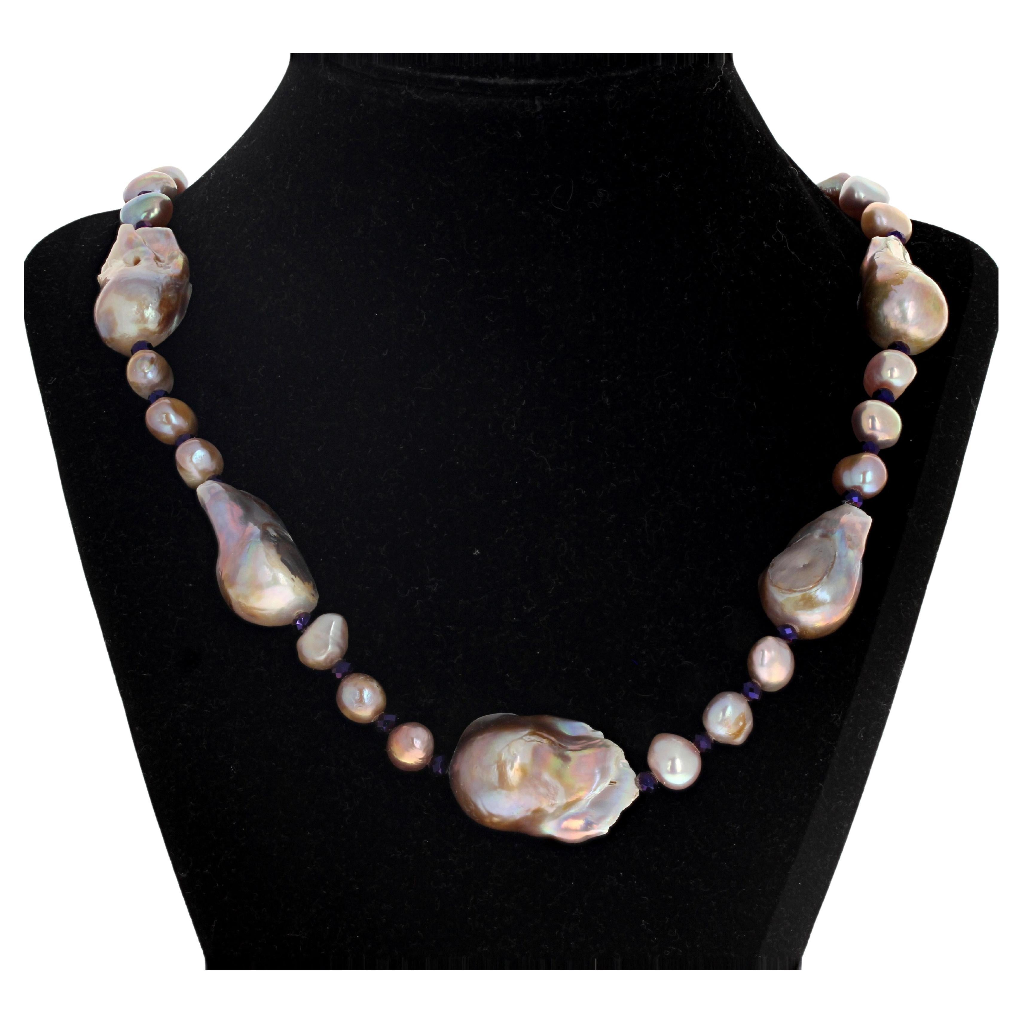 This necklace is 20 inches long and the Pearls are absolutely beautiful in their real multi-color reflections !!  The larger ones are approximately 30 mm long.  The smaller ones are approximately 10mm.  The necklace is 20 inches long and the clasp