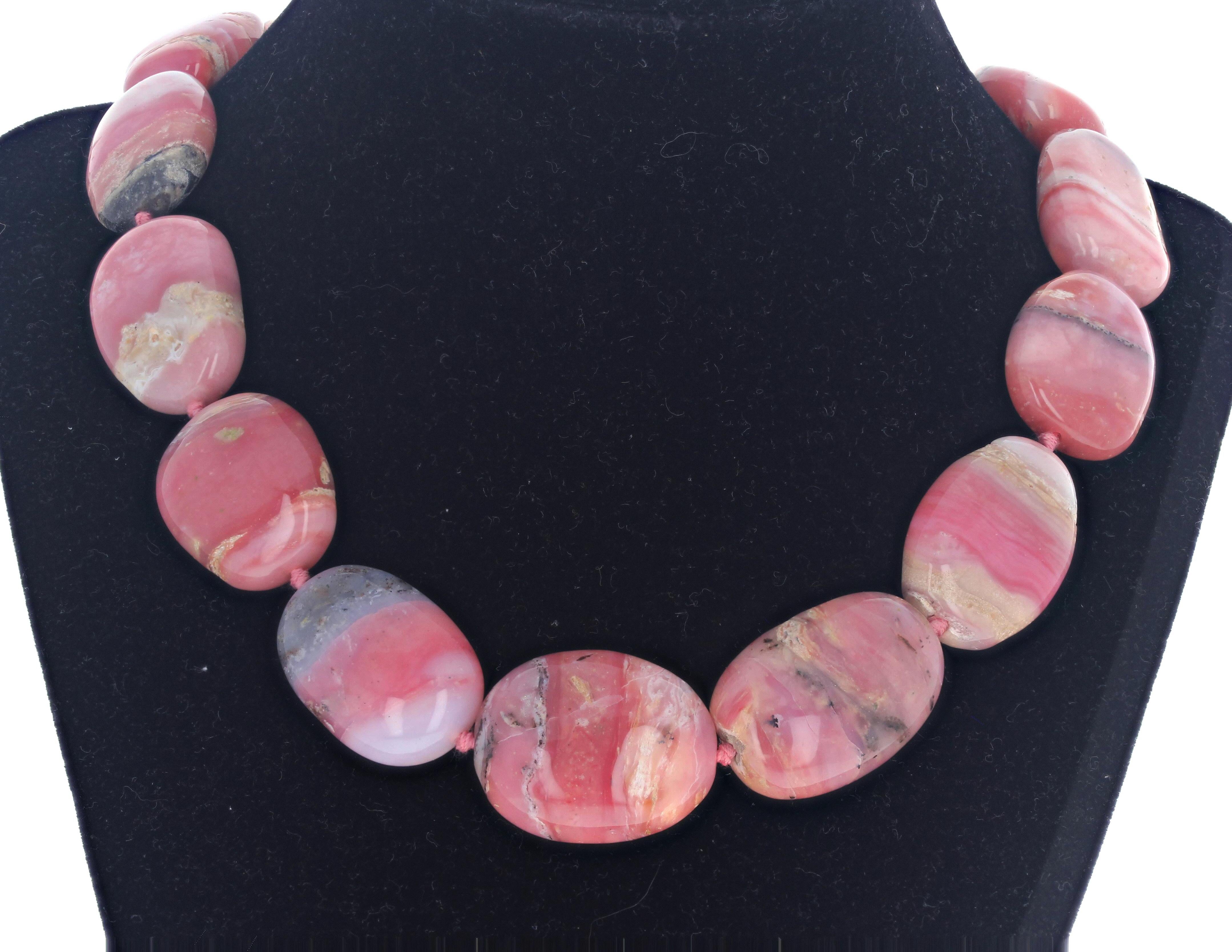 This fascinatingly artistically beautiful necklace is natural highly polished real Peruvian Opals.  The largest one is approximately 30mm x 24mm.  The clasp is an easy to us silver magnetic clasp.  These are very highly polished and are very natural