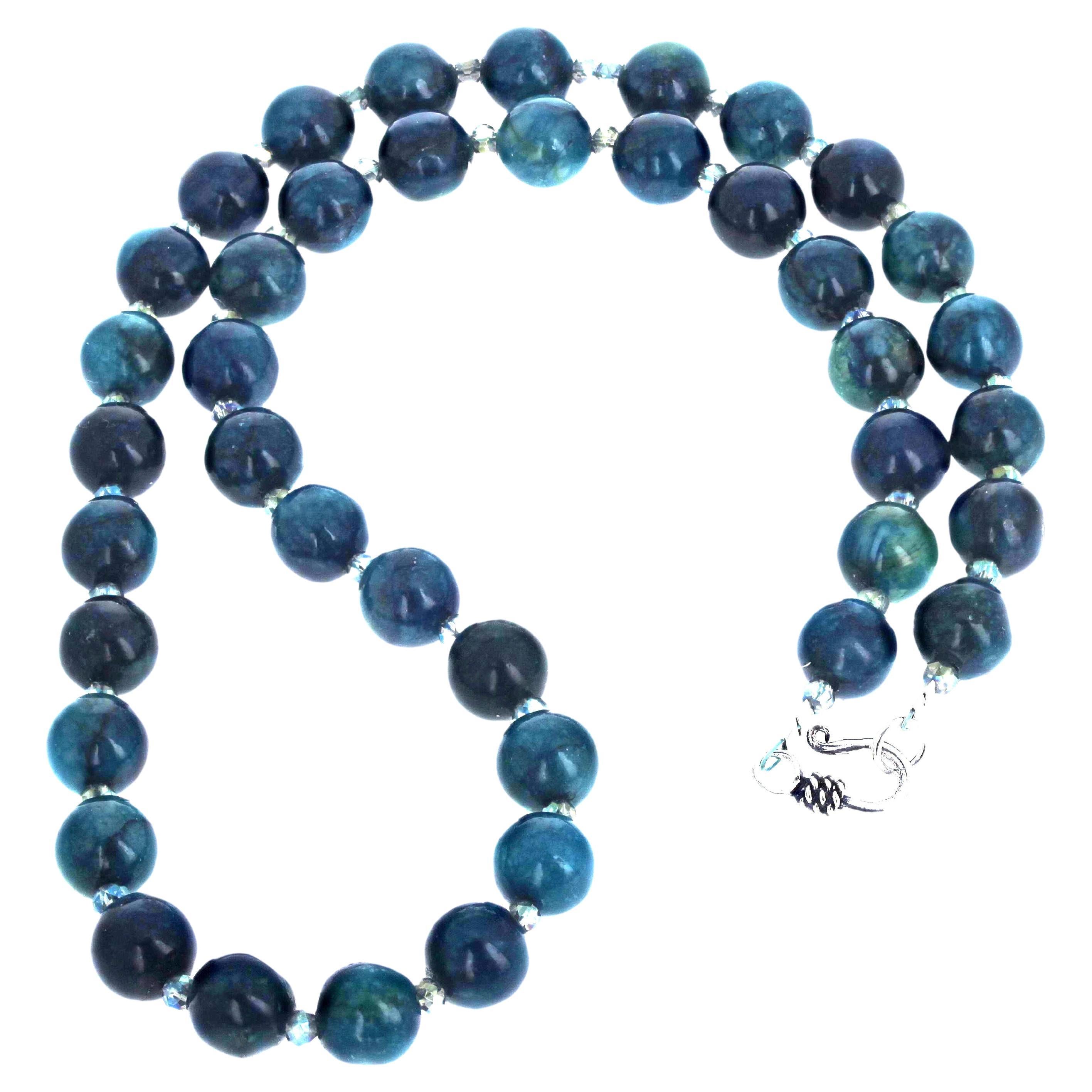Fascinating Many-colored shades of blue and blue-green natural Azurite.  The Azurites are 10mm and enhanced with glittering sparkling crystals.  The clasp is an easy to use silver plated hook clasp.  This necklace is 20 inches long.  