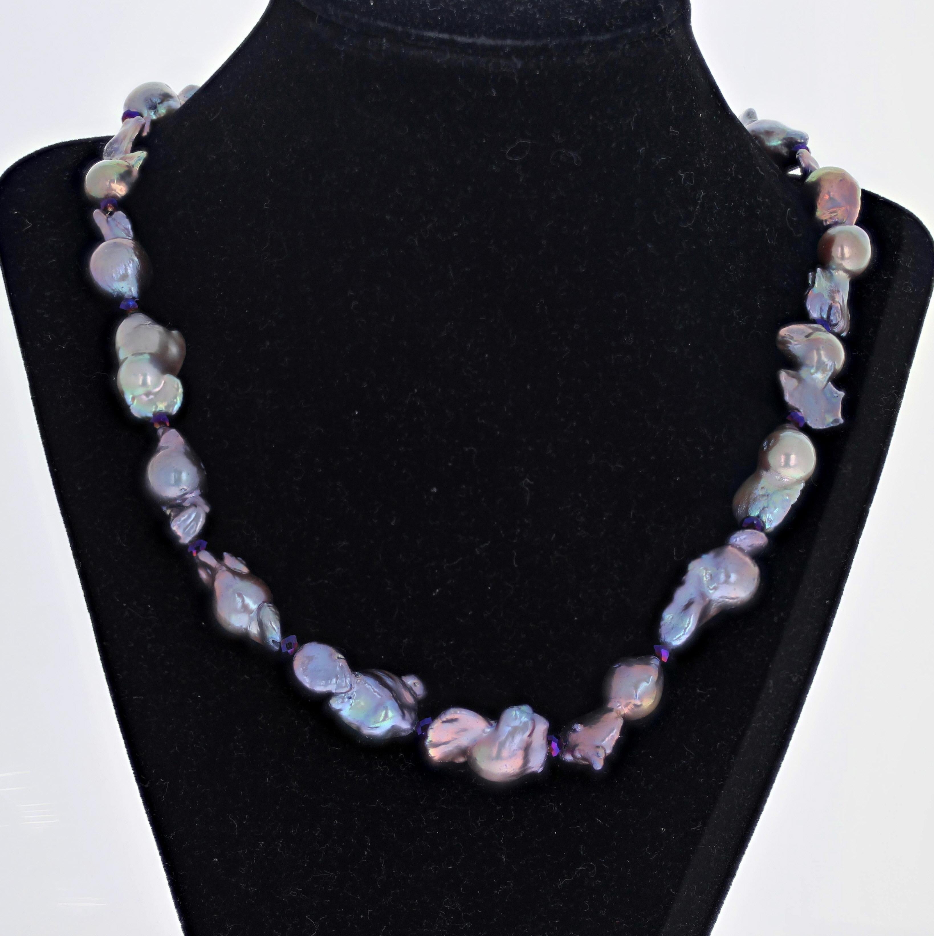 These fascinating natural colors of these real Pearls are brilliant and glitter magnificently.  The Pearls are all different gorgeous colors.  The largest one is approximately 14mm round x 27mm long.  Little brilliant real Amethysts enhance the