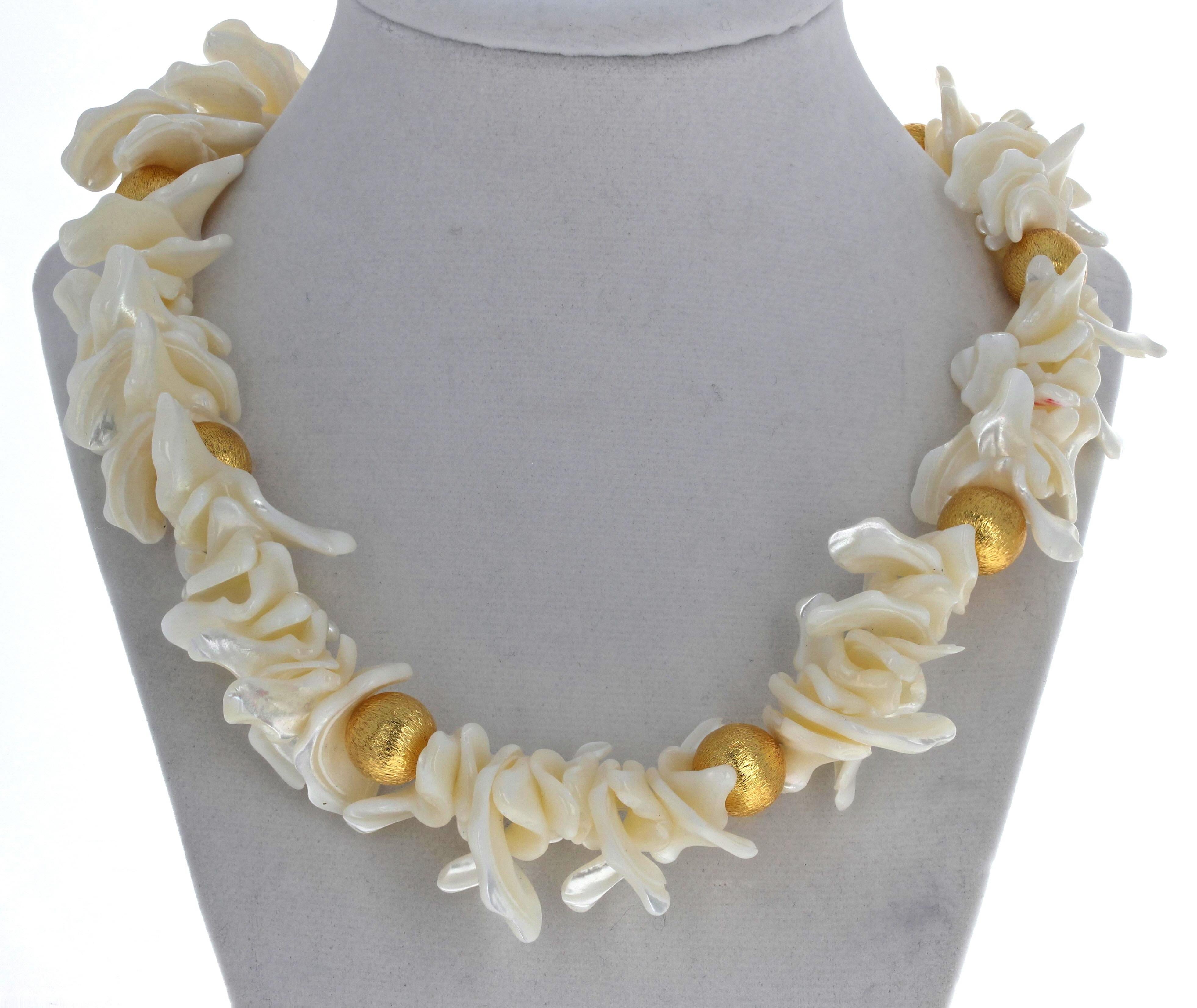 This magnificent 19 inch long natural white flip flop Pearls necklace is enhanced with yellow gold plated rondels.  The longest Pearls are approximately 1 1/4 inches long.  The large gold plated rondels are 13mm.  The clasp is an easy to use gold