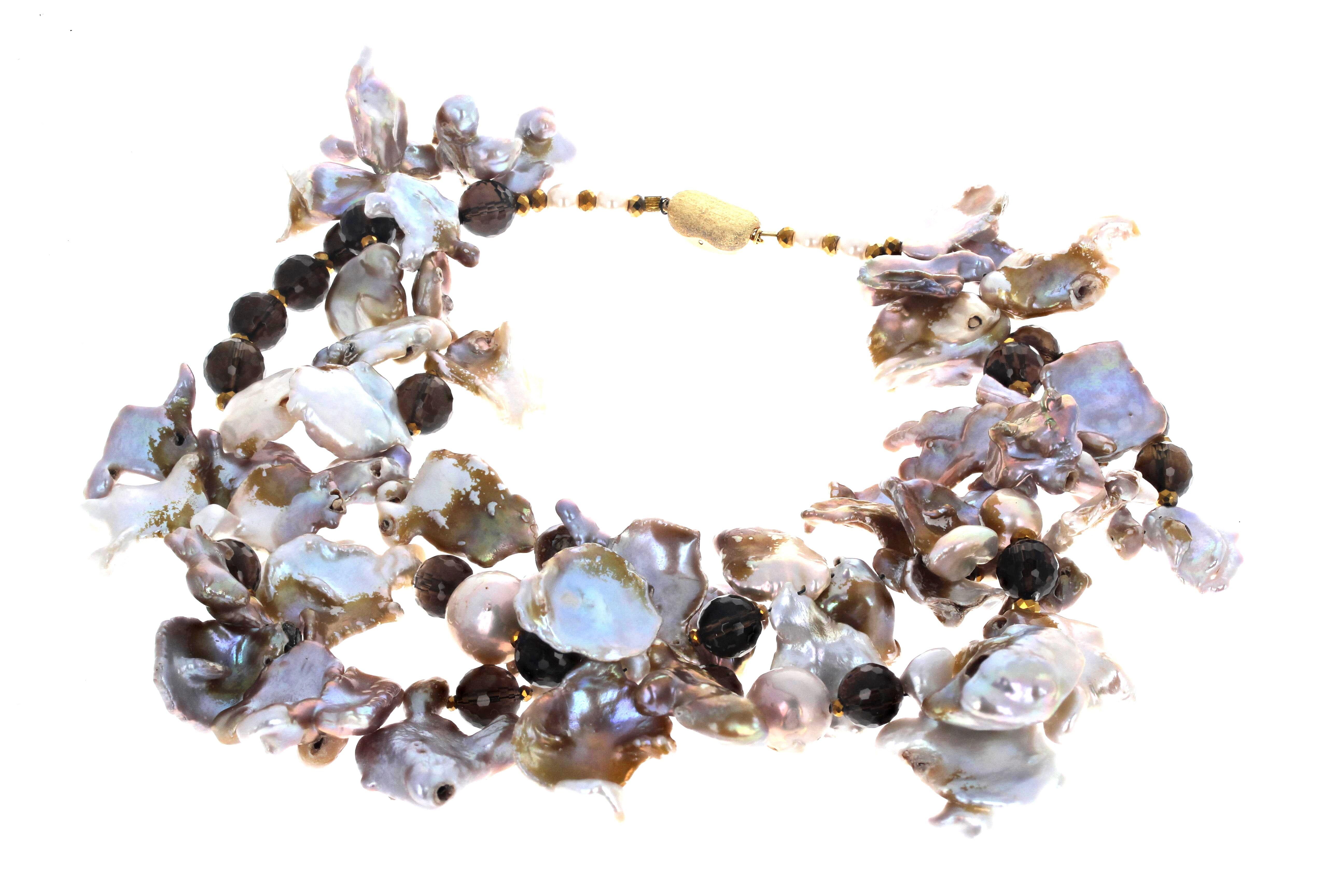 These beautiful natural real brilliant Pearls are in many different fascinating shapes and colors.  There is a lot of pink and blue and white.  It is enhanced with natural round gemcut real Smoky Quartz.  This is 16 inches long.  The clasp is an