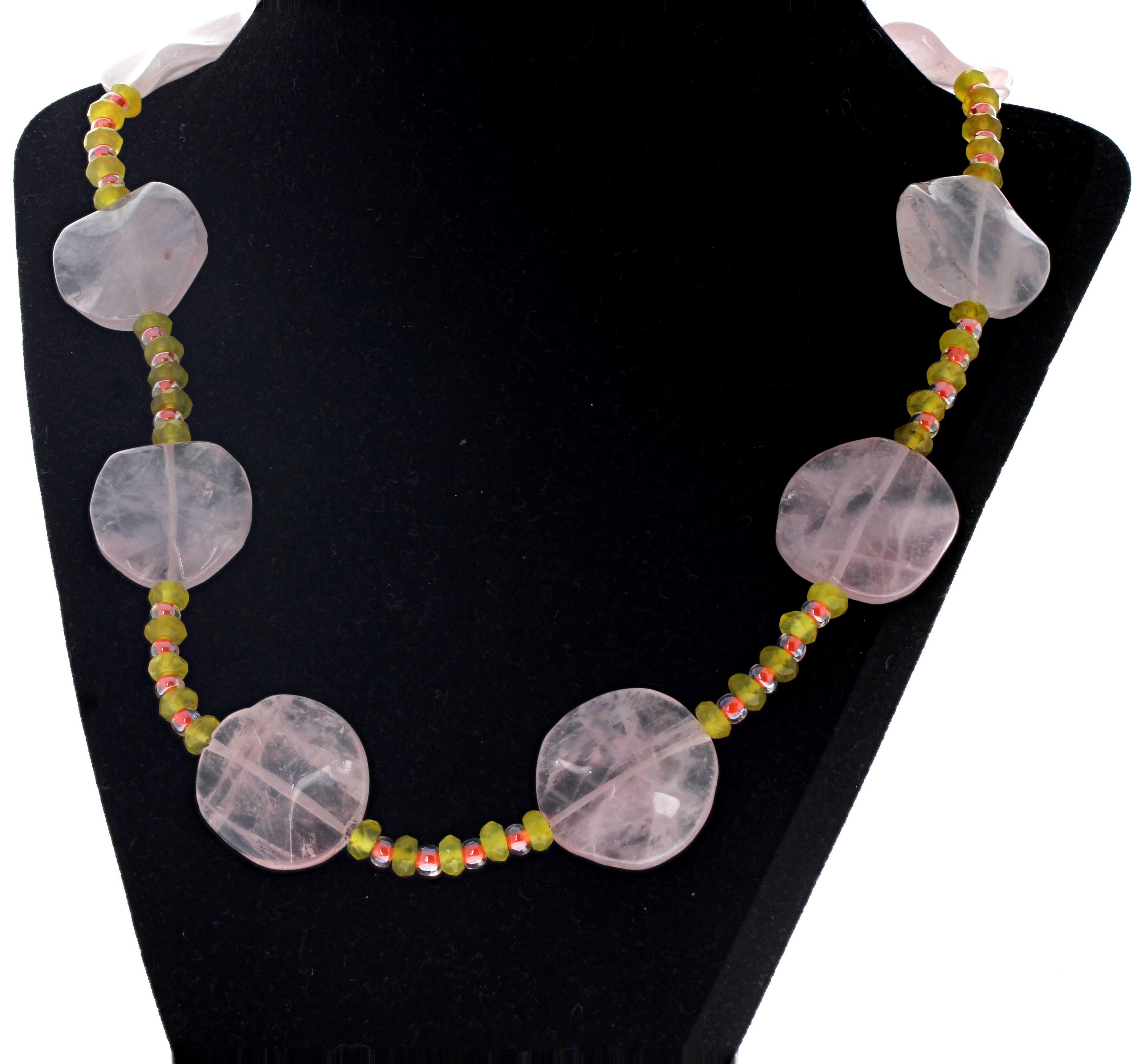 This original lovely real natural Pink Quartz (largest approximately 36mm across x 7 12mm thick) are enhanced with green Peridot and pinky red little rondels.  This pretty necklace is  20 1/2 inches long.  The clasp is an easy to use sterling silver