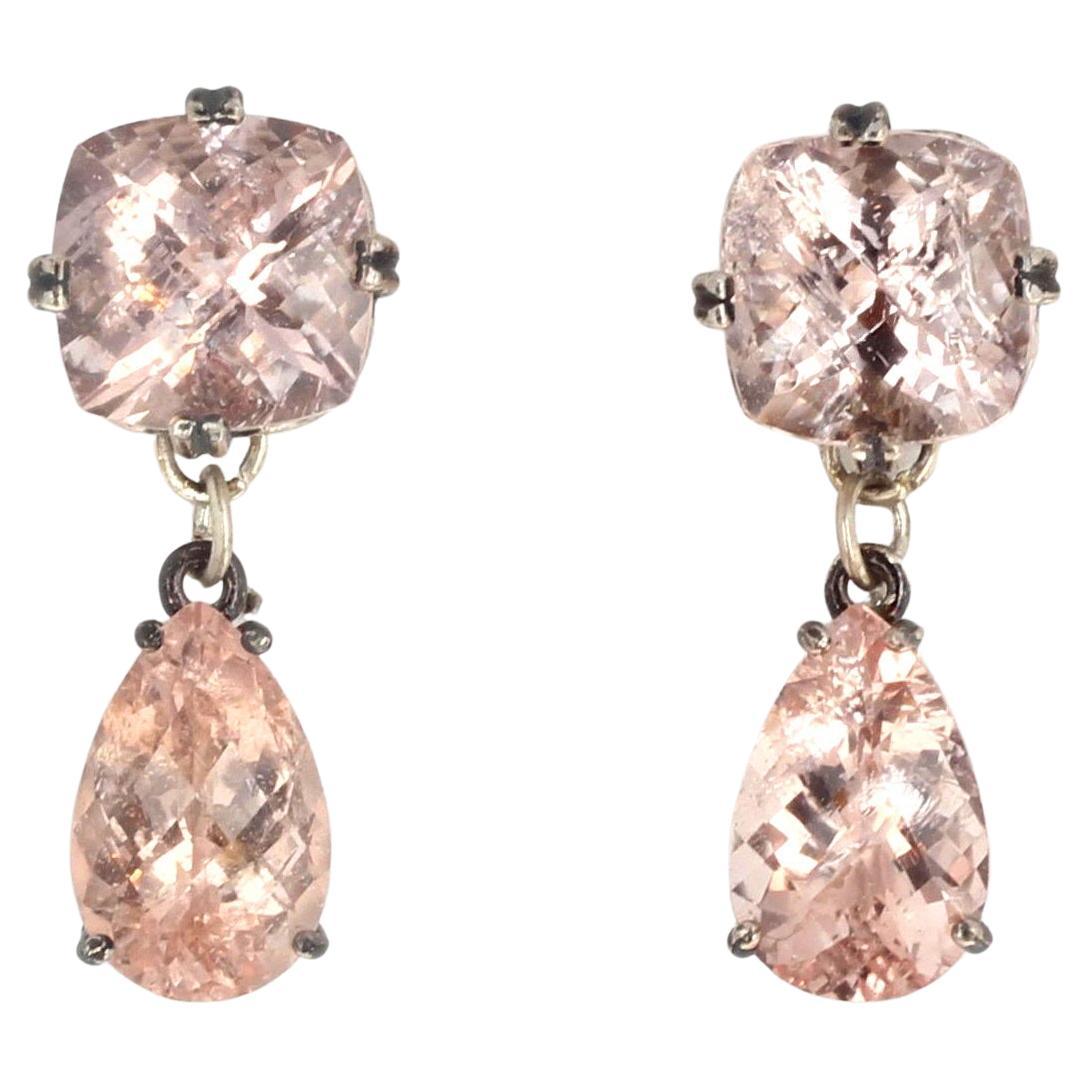 These 21 carats total of brilliant pink Morganites hand 30mm long.  They are a clear pink (they don't photograph well on my camera). The cushion cut top ones are 12mm x 12mm and the dangling pear shaped ones are 14.2m x 9mm.  They are set in