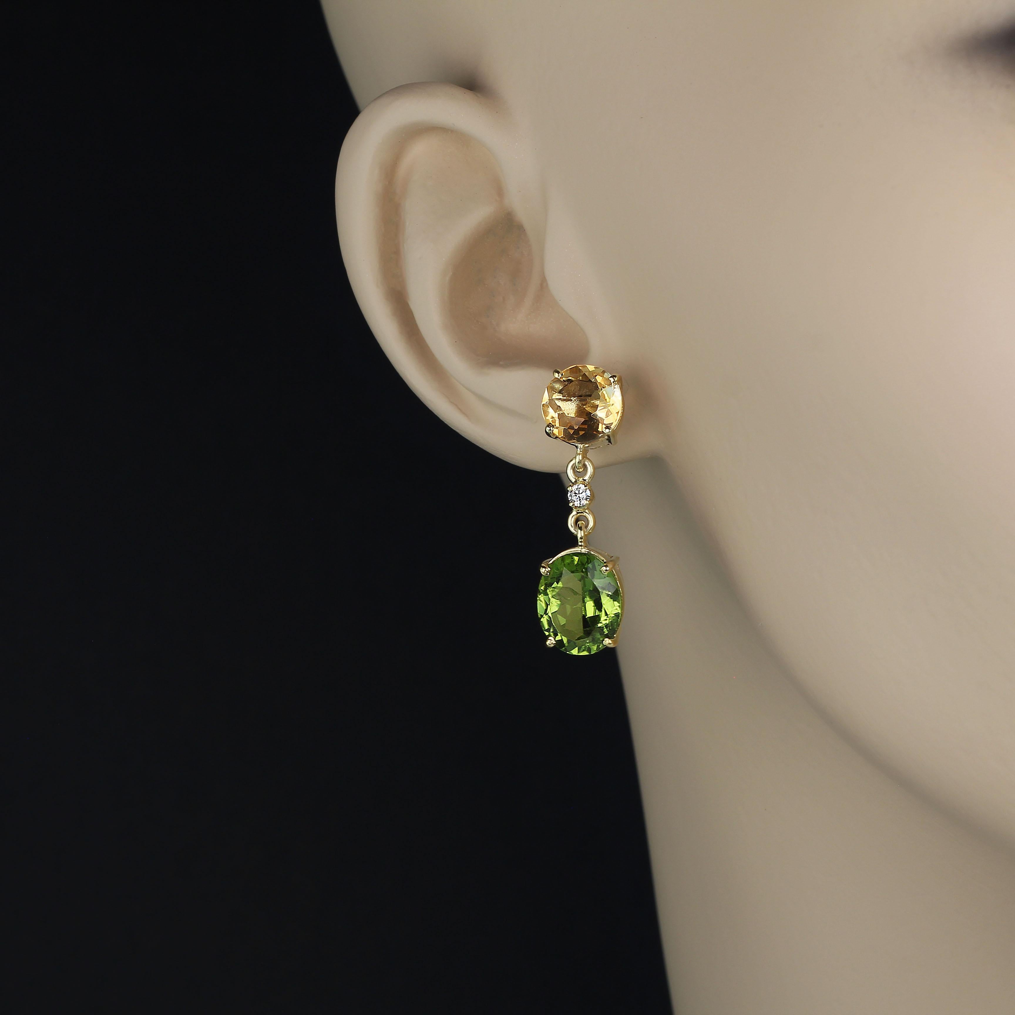 Golden Citrine and Brilliant Green Peridot Dangle Earrings. These gorgeous earrings feature 8MM round golden Citrines weighing total 4.5ct and green oval Peridot total 8.25ct. These earrings have a drop of 1 1/8 inches. 
In ancient times people
