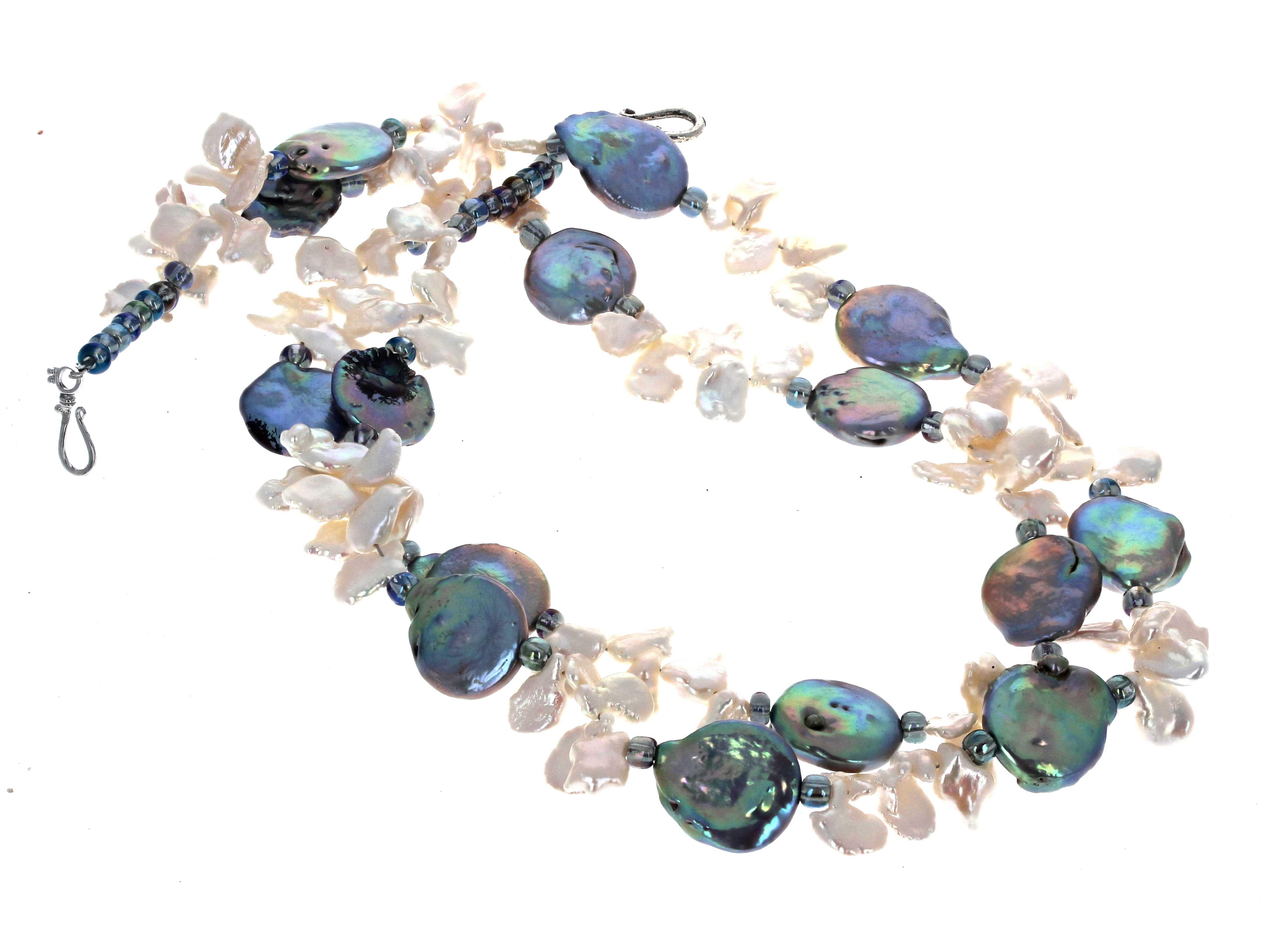 These roundish natural gorgeous Pearls have all different natural colors.  They are approximately 15mm.  The little whitish Pearls flip-flop and are approximately 10mm.  The clasp is an easy to use silver hook clasp.  This is 17 inches long.  