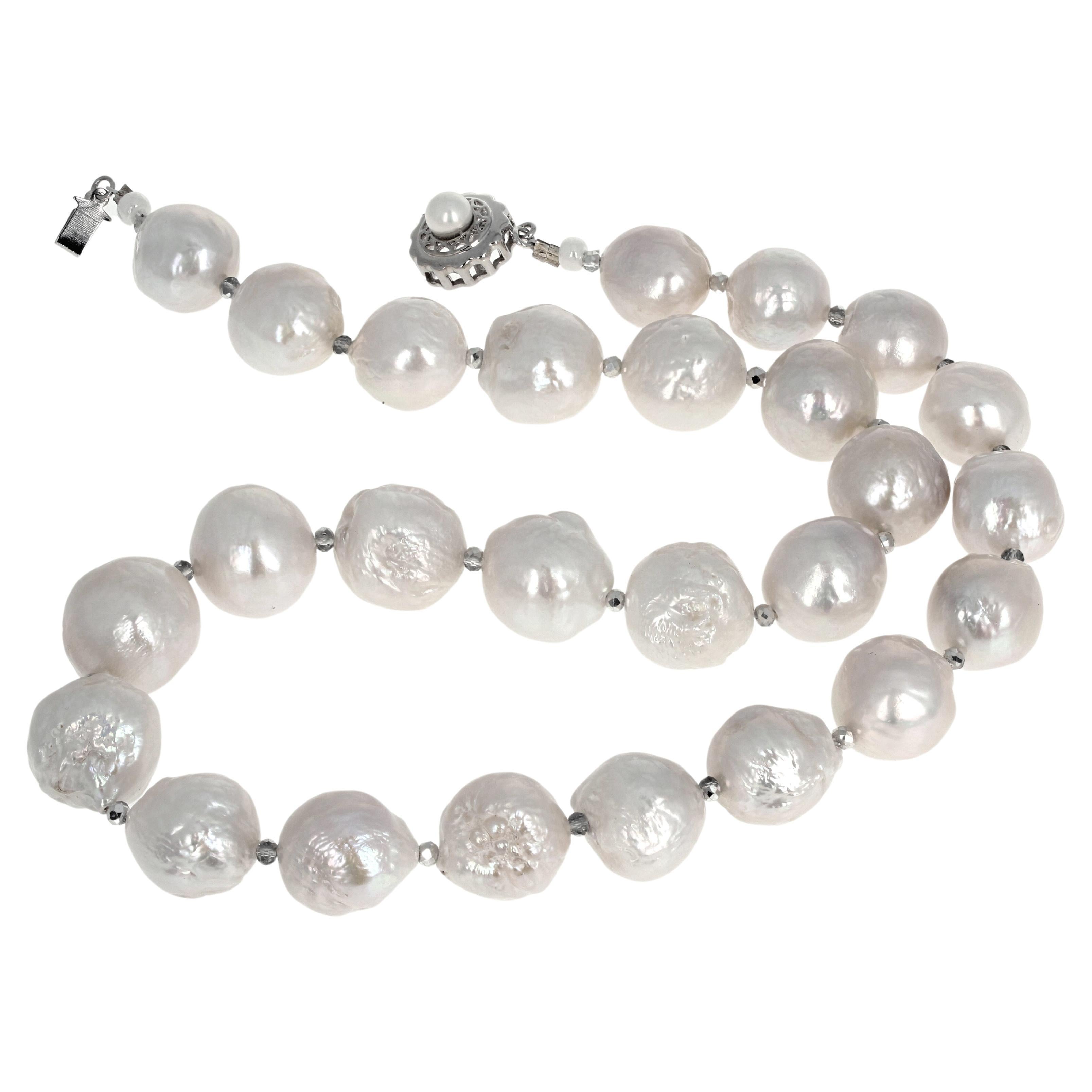 These are truly magnificent approximately 17mm real cultured White Pearls set in this 19 12 inch long necklace.  (They are not grey - they are white white white). The clasp is an easy to use slide-in clasp.  If you want a simple hook clasp we sill