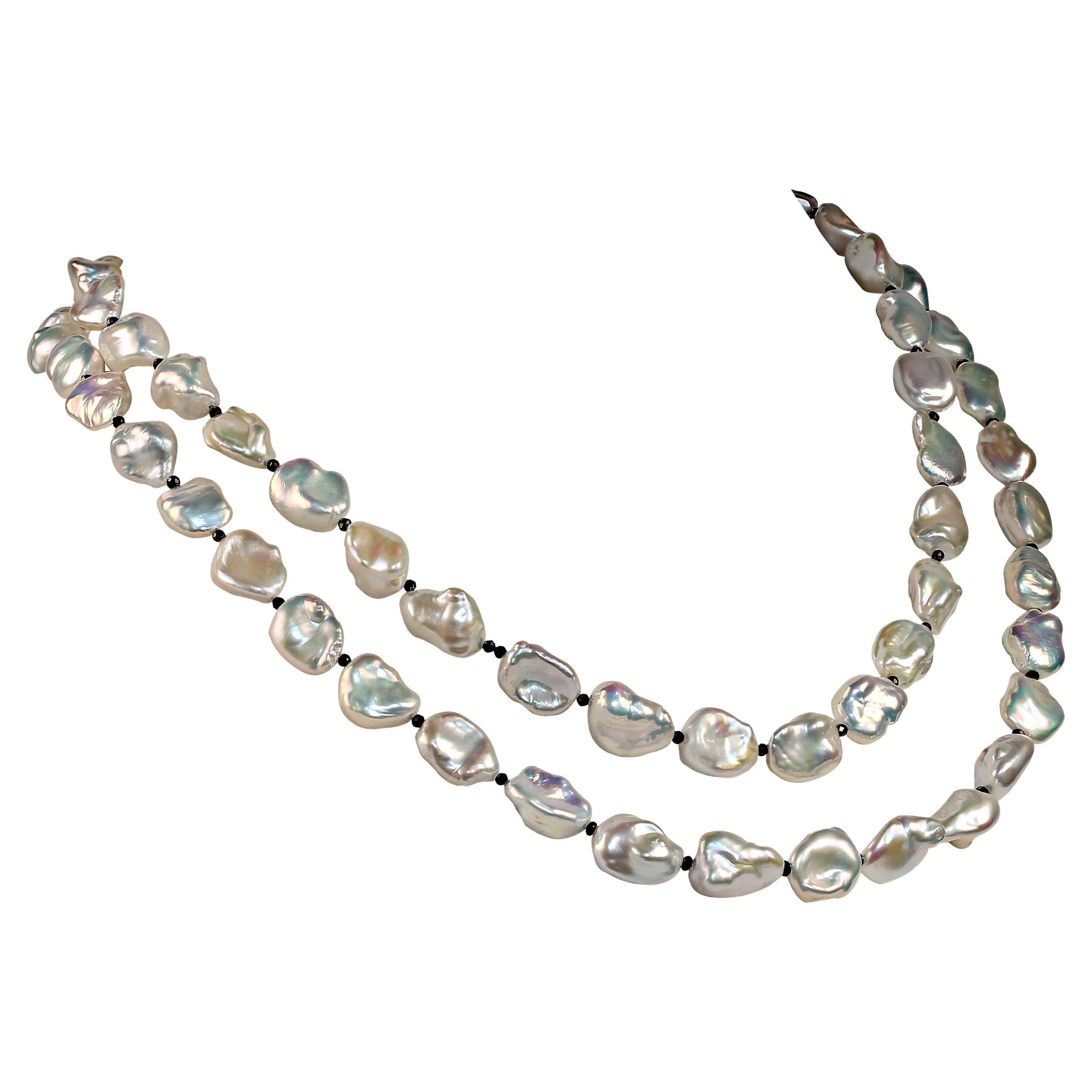 I love these Pearls! They have that unique feel of luxury. This unique necklace shimmers and glows. These Keshi Pearls are from a second Harvest of the mollusk and are simply luscious. They are silvery with great iridescence. Tiny faceted Black