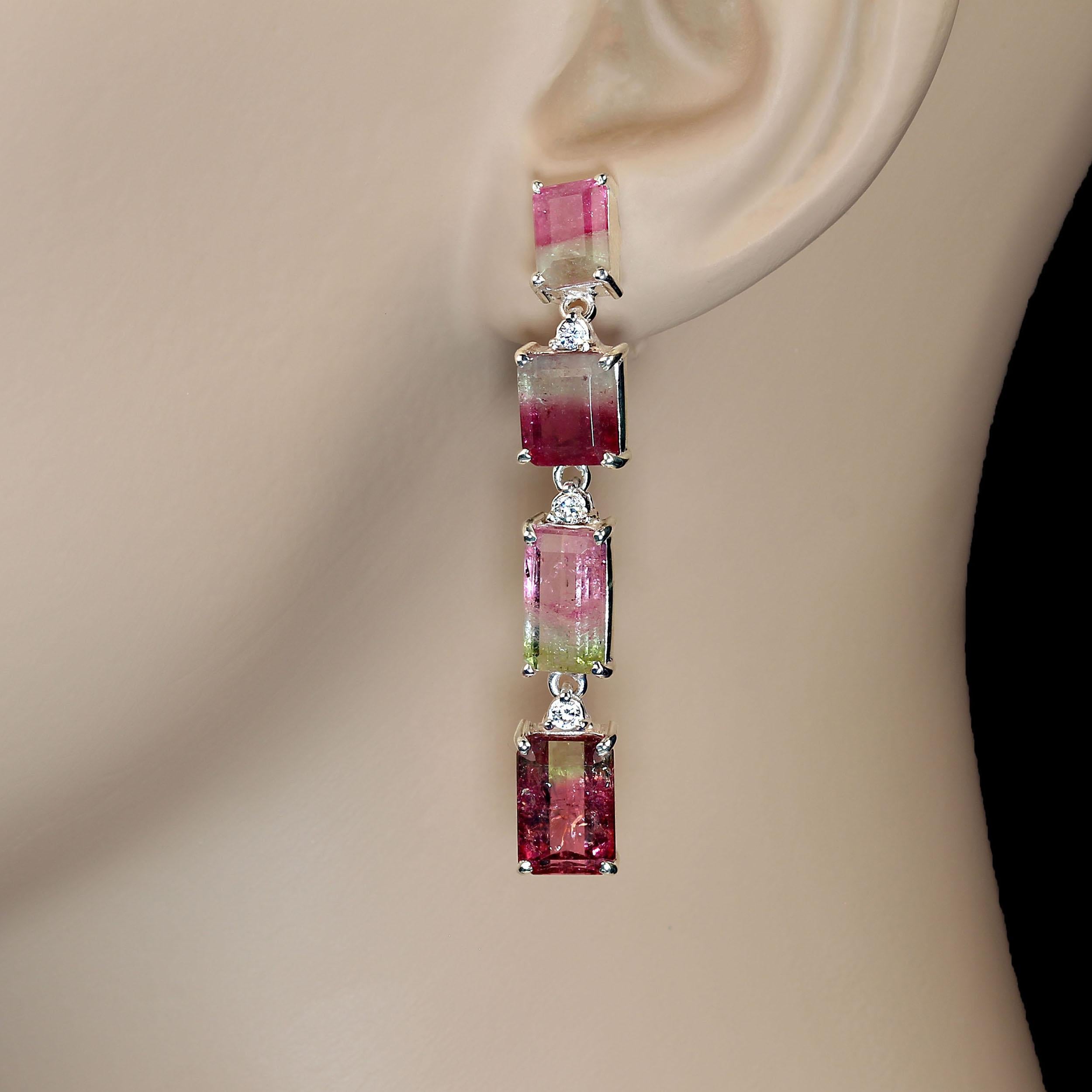 One of a kind Bi-Color Tourmaline Earrings in long swinging lines. These pink and green emerald cut Tourmalines each have their own character. One earring is closer to 2 inches in length, the other about 1.75 inches. Each Tourmaline is individually