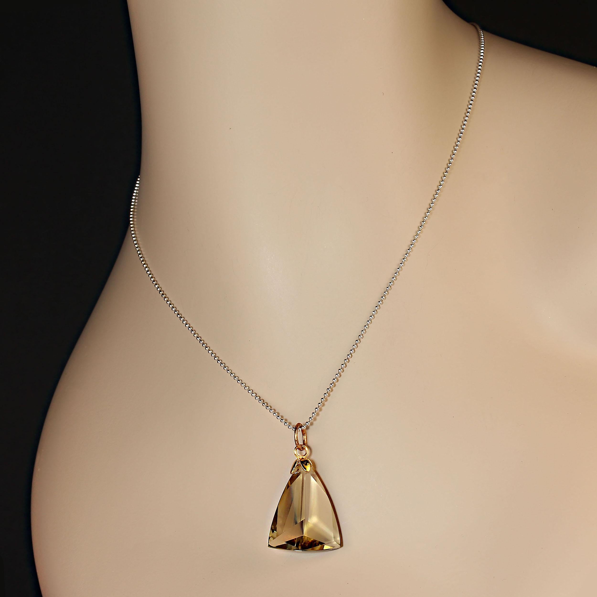Lovely Green gold quartz triangular pendant, 20 x 25 MM which is faceted on both sides. The top is has a nice sized bail for your chains to slip through.  This great green gold is the perfect color to coordinate with all your winter ensembles.  This