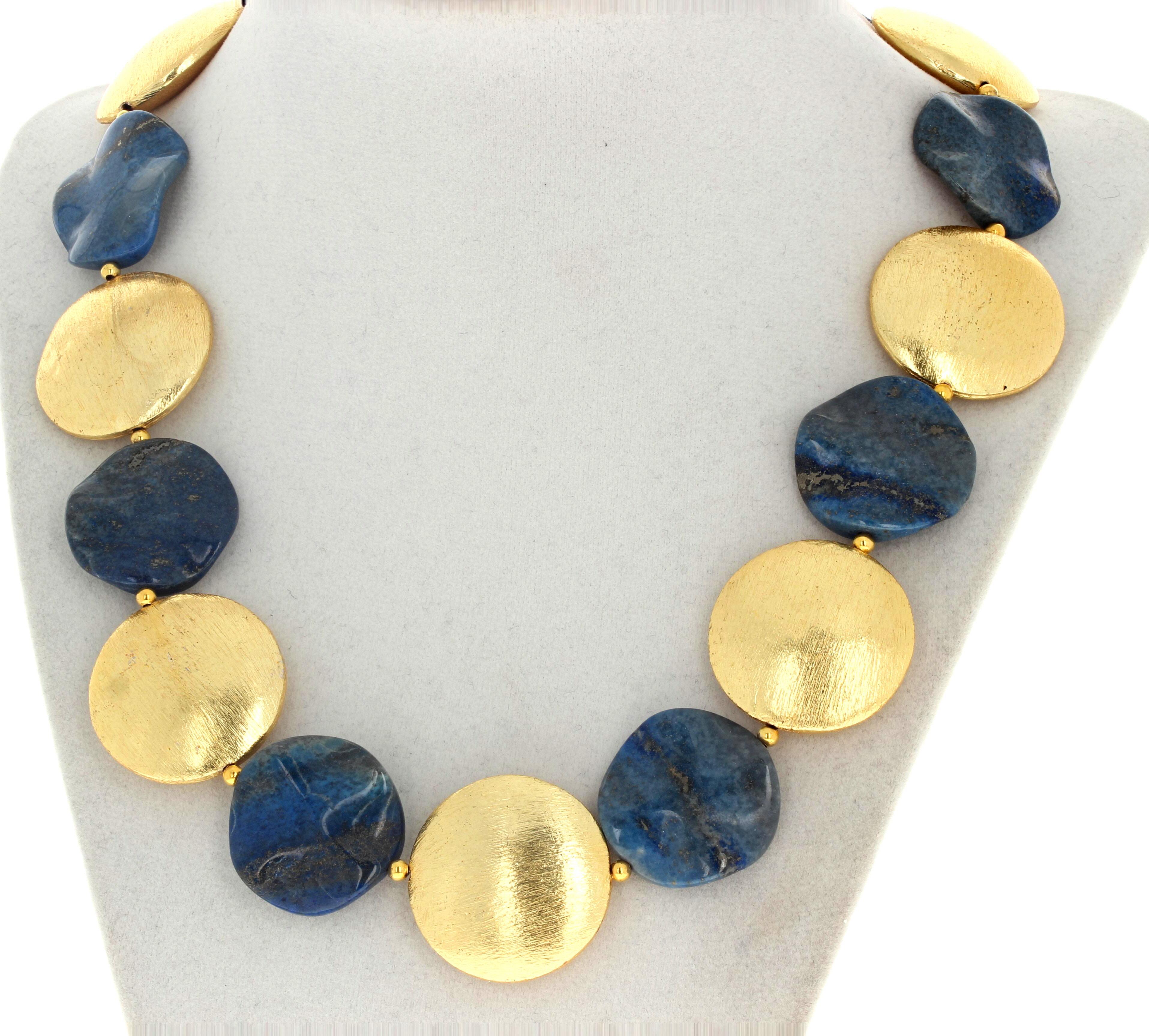 This dramatic beautiful necklace is 19 1/2 inches long.  The large glowing gold plated rondels are approximately 18 1/2mm and the beautiful blue natural Lapis Lazuli are approximately 25mm.  The clasp is an easy to use gold plated hook clasp. 
