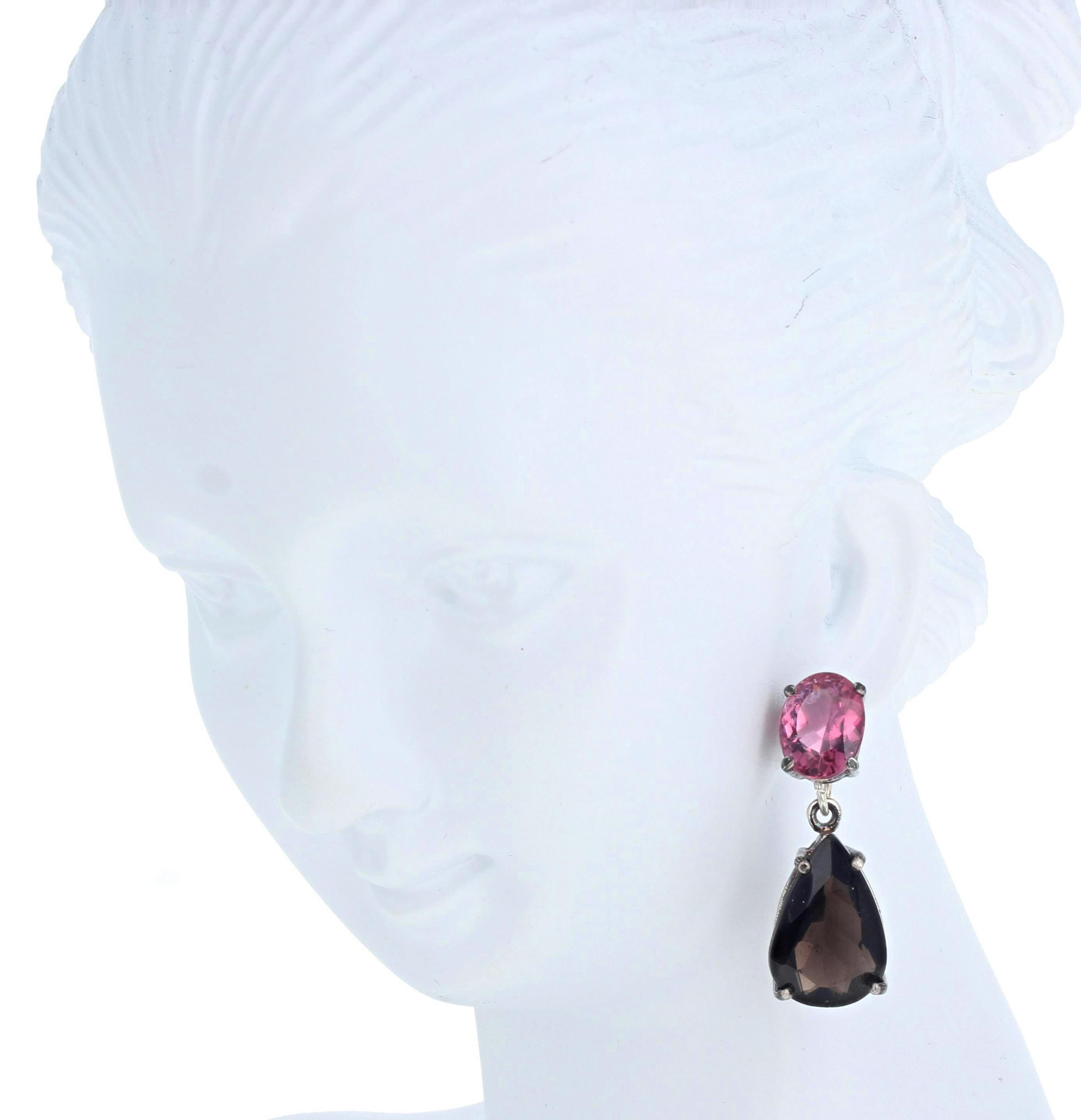 These intensely pink brilliant natural Tourmalines total 3.5 carats (9mm x 6 1.2nn) dangle lovely very dark  pear cut natural 8.15 carats of Smoky Quartz (14.3mm x 10mm).  They are set in easy to use Sterling Silver stud earrings.  