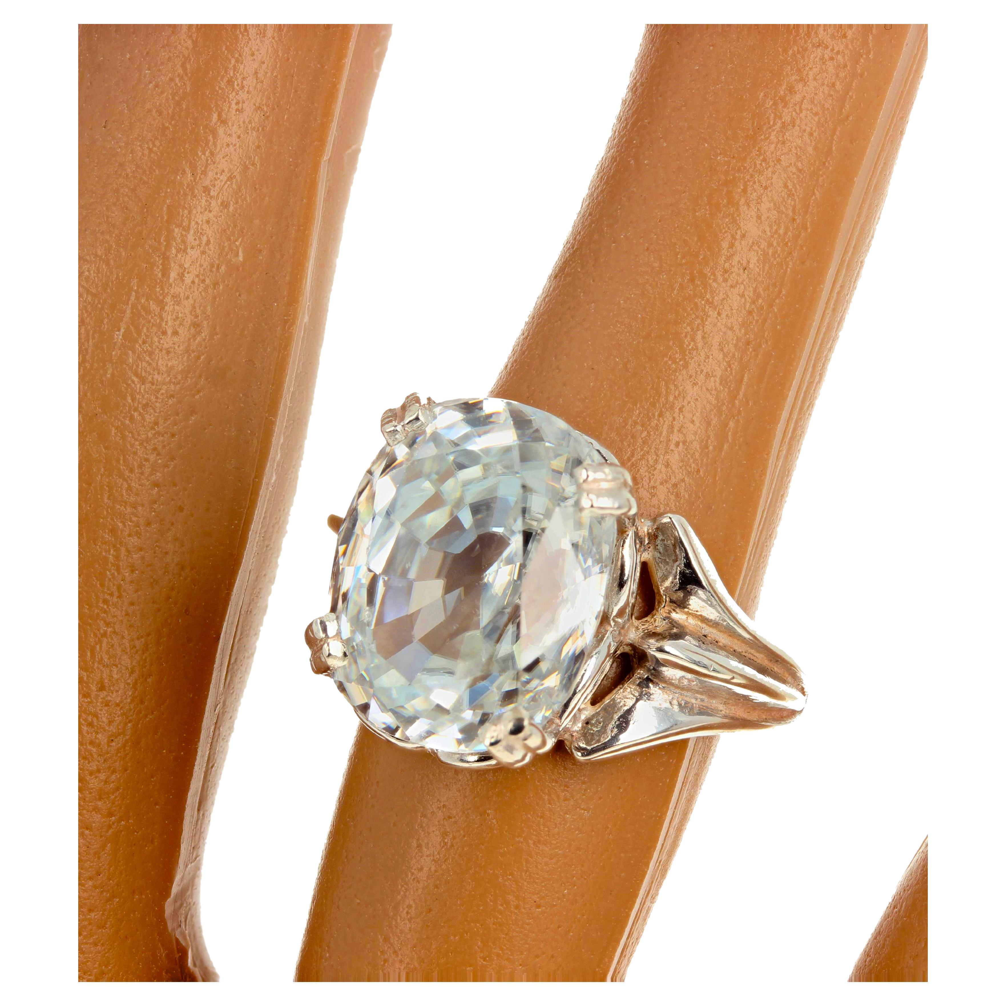 This gorgeous 14.6 mm x 12 mm glittering white natural Cambodian Zircon looks like a huge diamond on your hand !!  These 15.69 carats sit up brilliantly on this sterling silver ring size 7 (sizable).  There are no eye visible inclusions in this