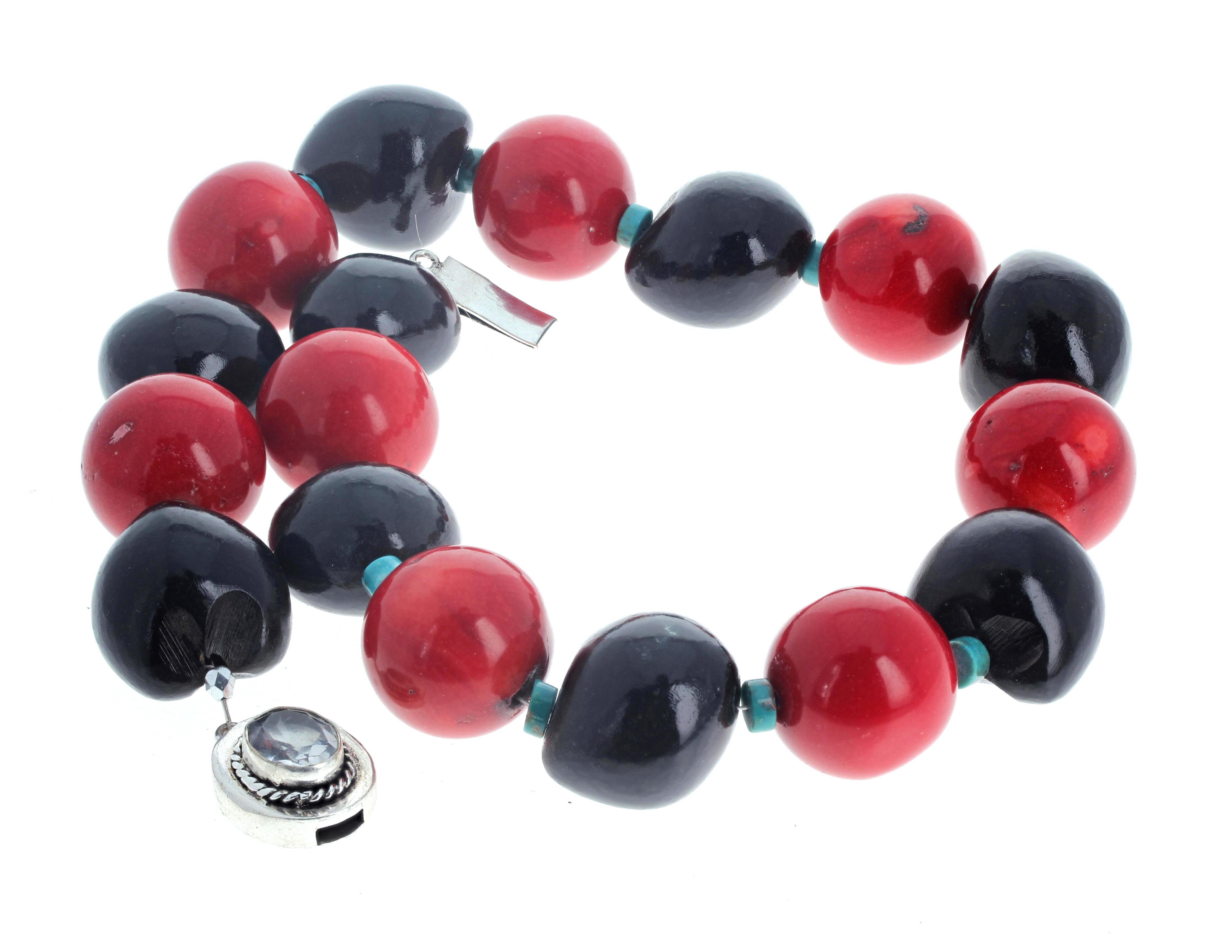 This VERY Large 18 1/2 inches long necklace is very dramatic.  The artistic black Wood rondels are different sizes but approximately 23mm x 24mm.  The highly polished natural real red round Coral are approximately 23mm.  The little lovely blue