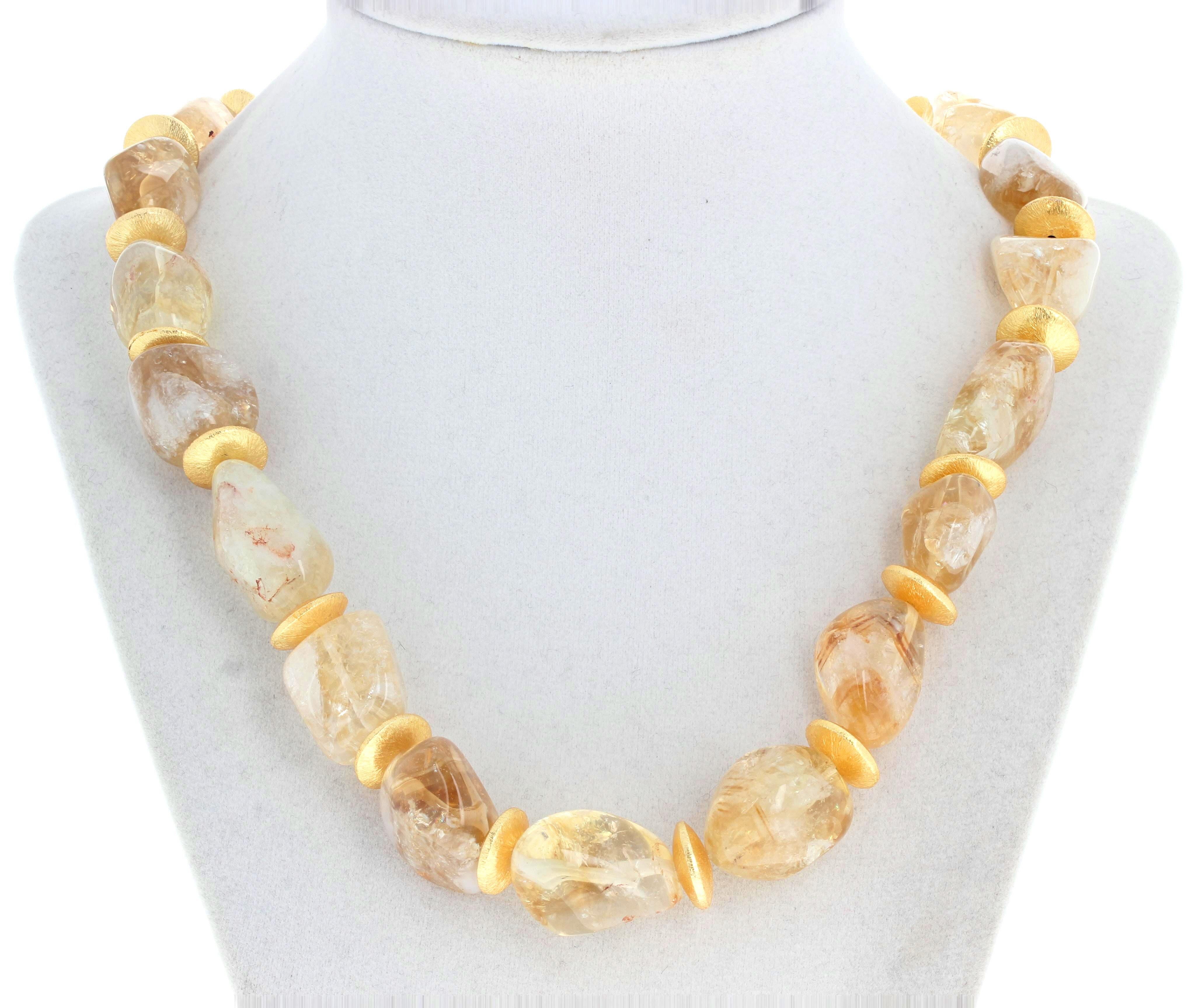 These highly polished translucent natural goldy real Citrines (largest approximately 28mm x 16mm glitter and glow brilliantly around your neck.  They are enhanced with large gold plated 12mm rondels that also glow profusely.  The clasp is an easy to