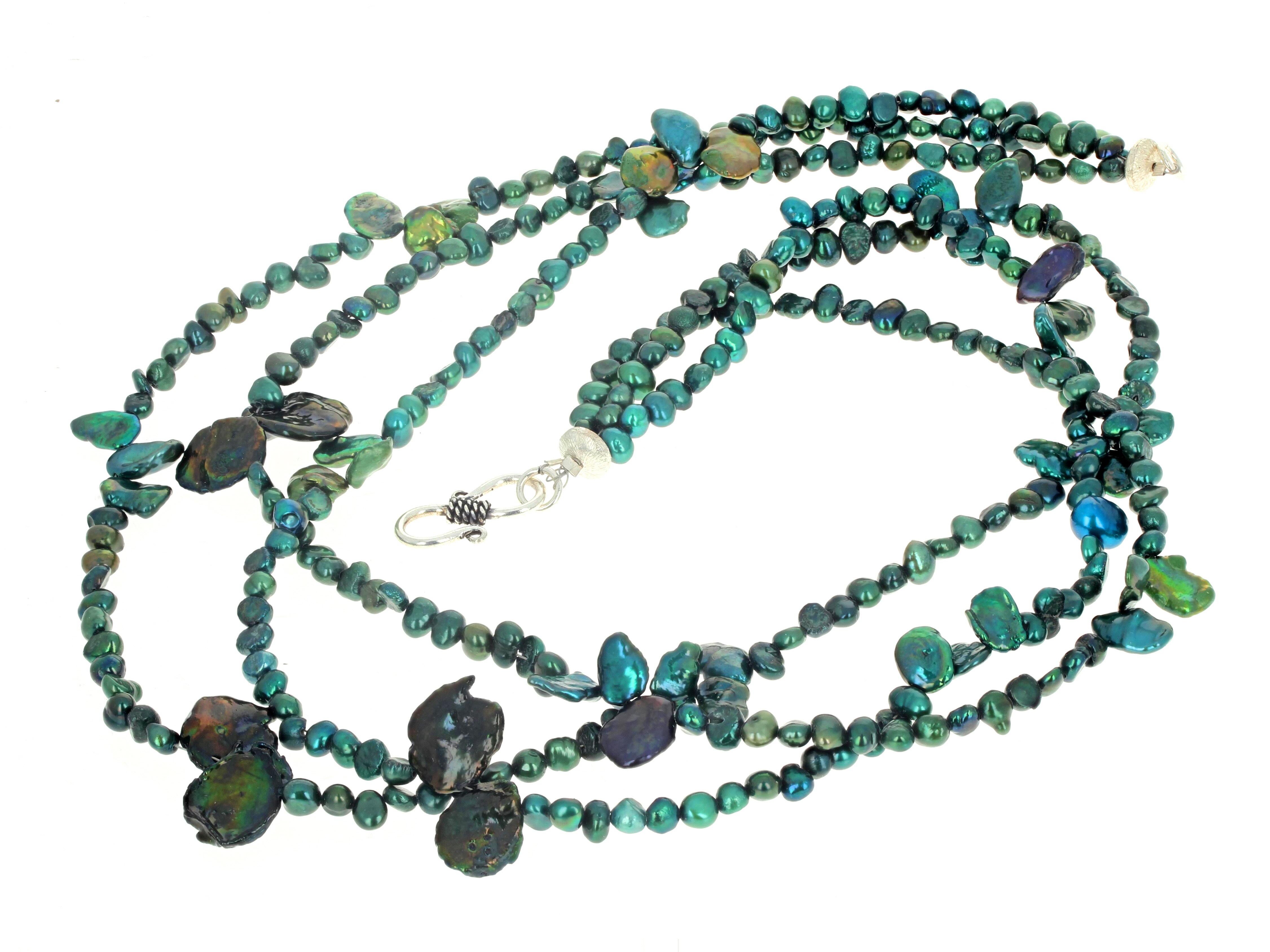 This beautiful triple strand of bluegreen real cultured Pearls enhanced by the natural bluegreen Pearl shells are set in this 19 1/2 inch long triple strand necklace.  They flip and flop magnificently.  The silver clasp is an easy to use hook clasp.