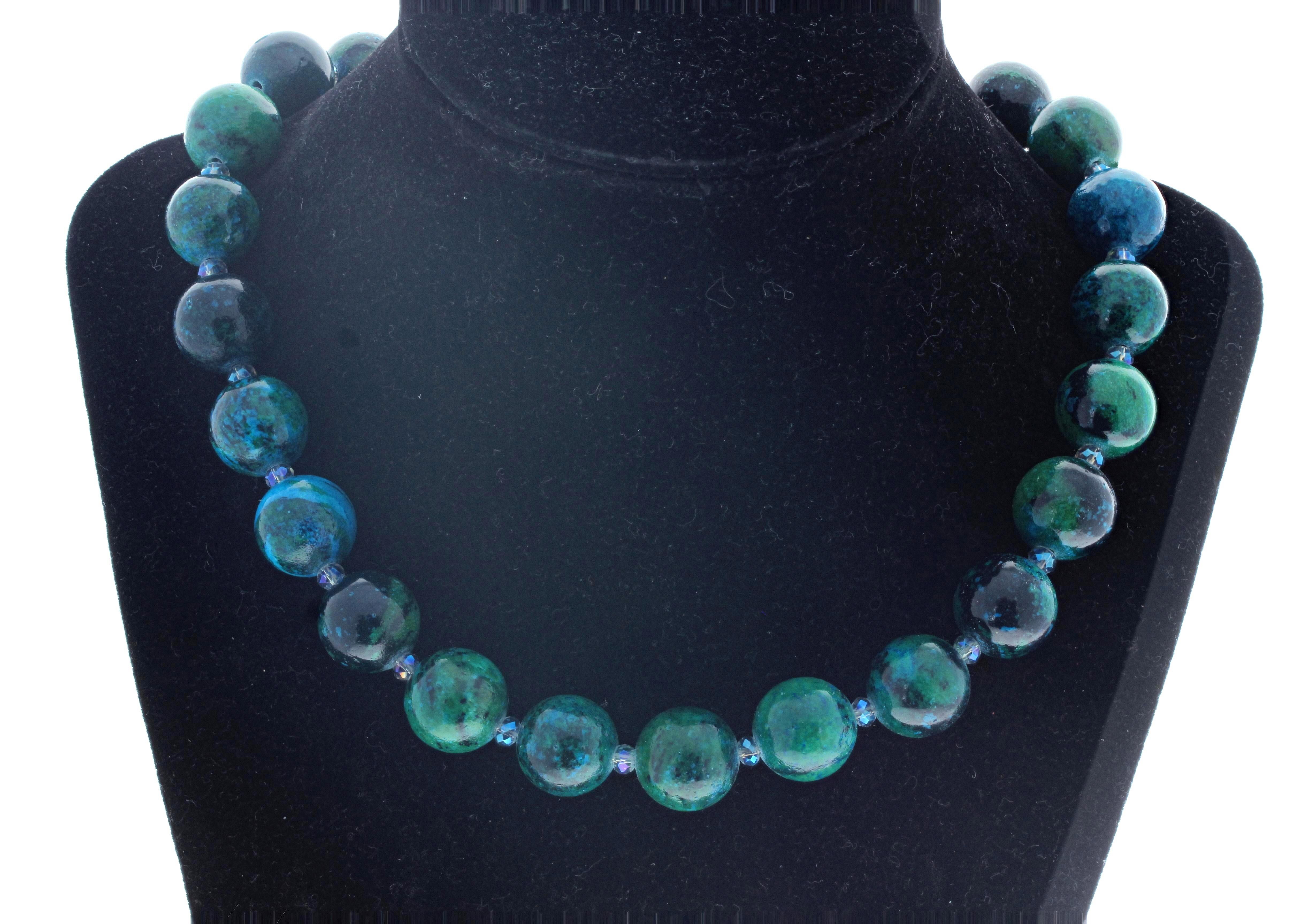 This beautiful highly polished natural real Chrysocolla 17 inch long necklace glows beautifully.  They are all approximately 15mm.  The little sparklers in between the gemstones are a fascinating blue-green color.  The clasp is an easy to use silver