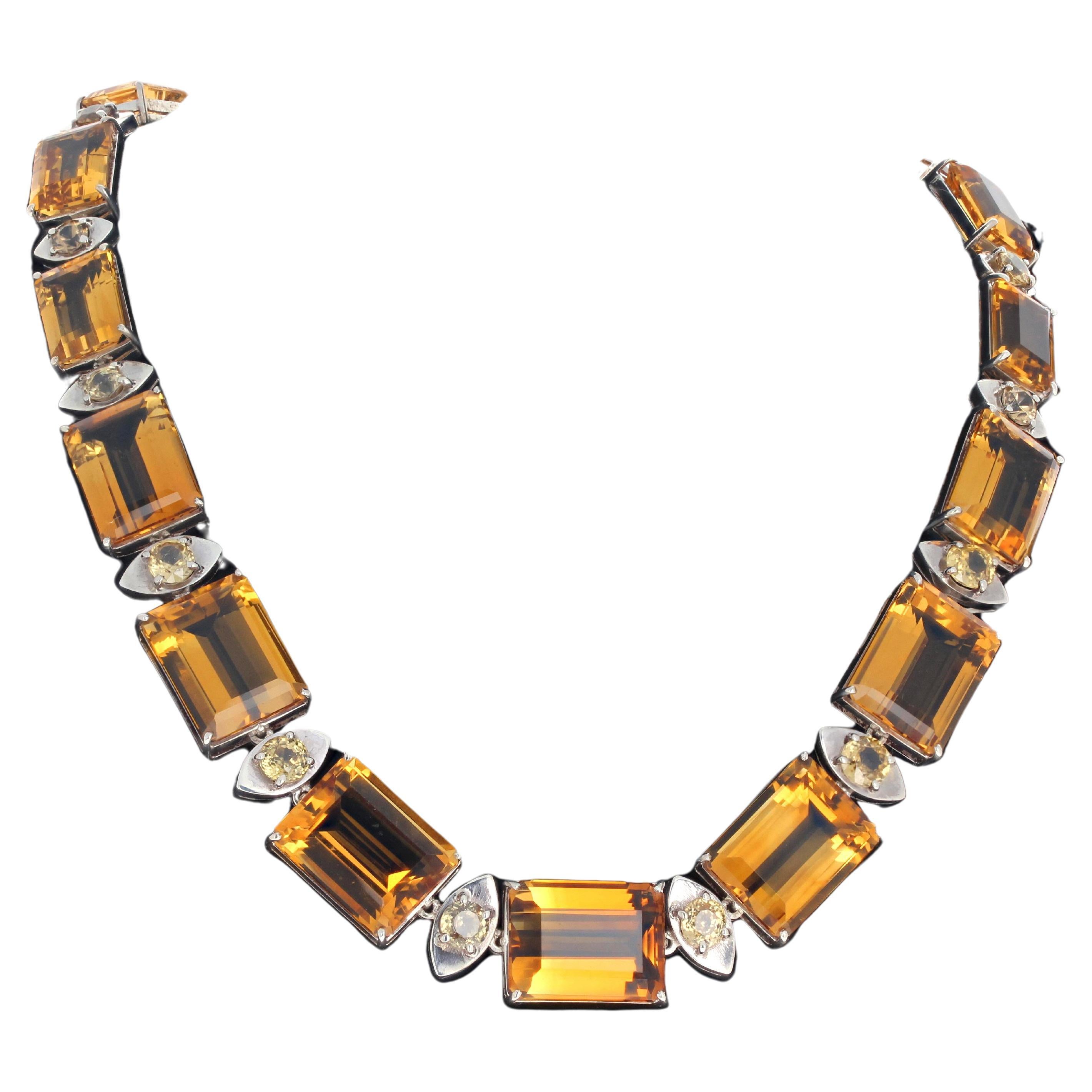 This amazing real Citrines necklace is 18 1/2 inches long with an easy to us sterling silver slide-in clasp.  The largest gemstone is 21mm x 16/2mm.  The largest gemstone is approximately 22.86 carats.  This sits magnificently and comfortably around