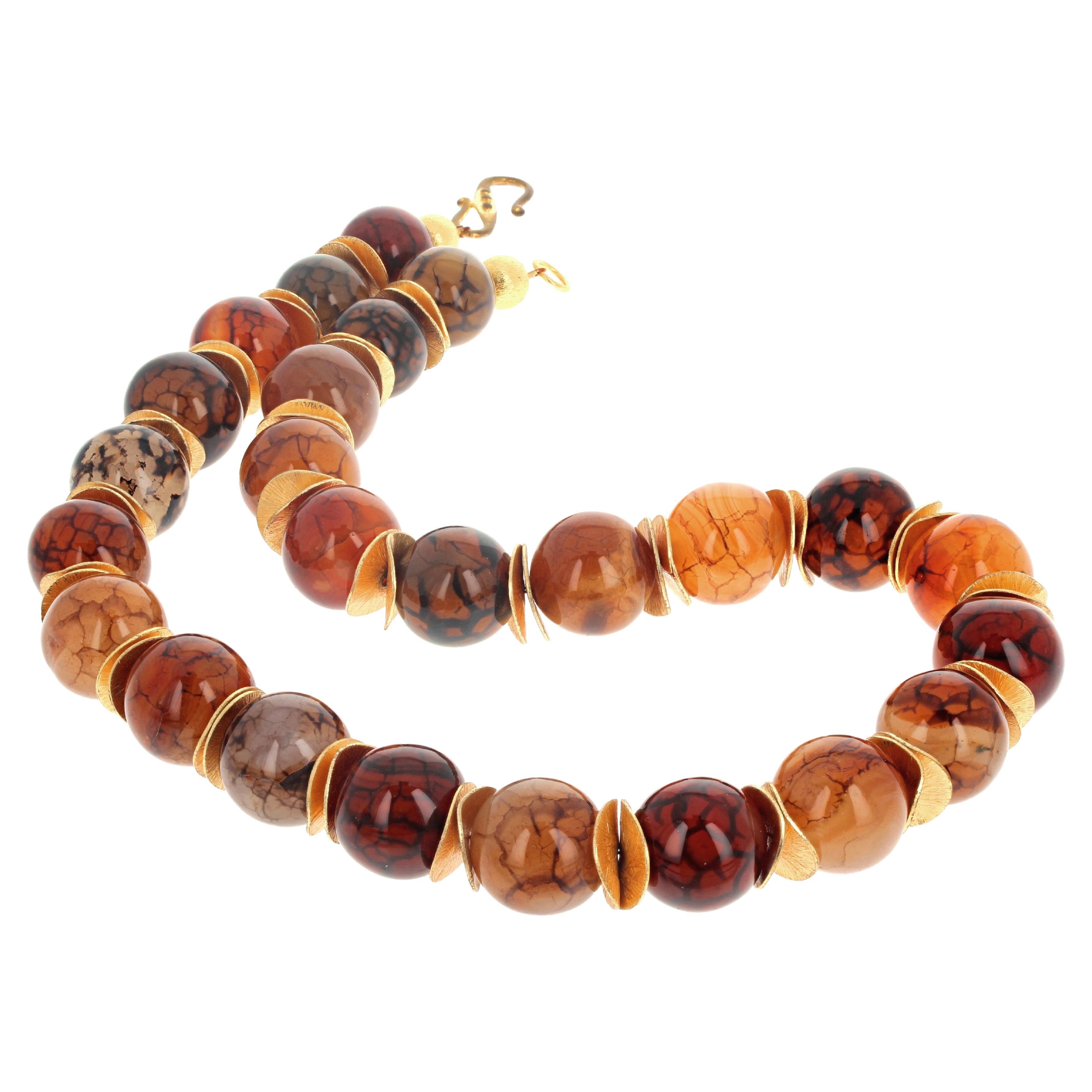 Gorgeous beautiful round natural Spiderweb Agates 18 1/2 mm in diameter with lovely gold plated petals.  This lovely necklace is 21 inches long and has an easy to use gold plated hook.  
