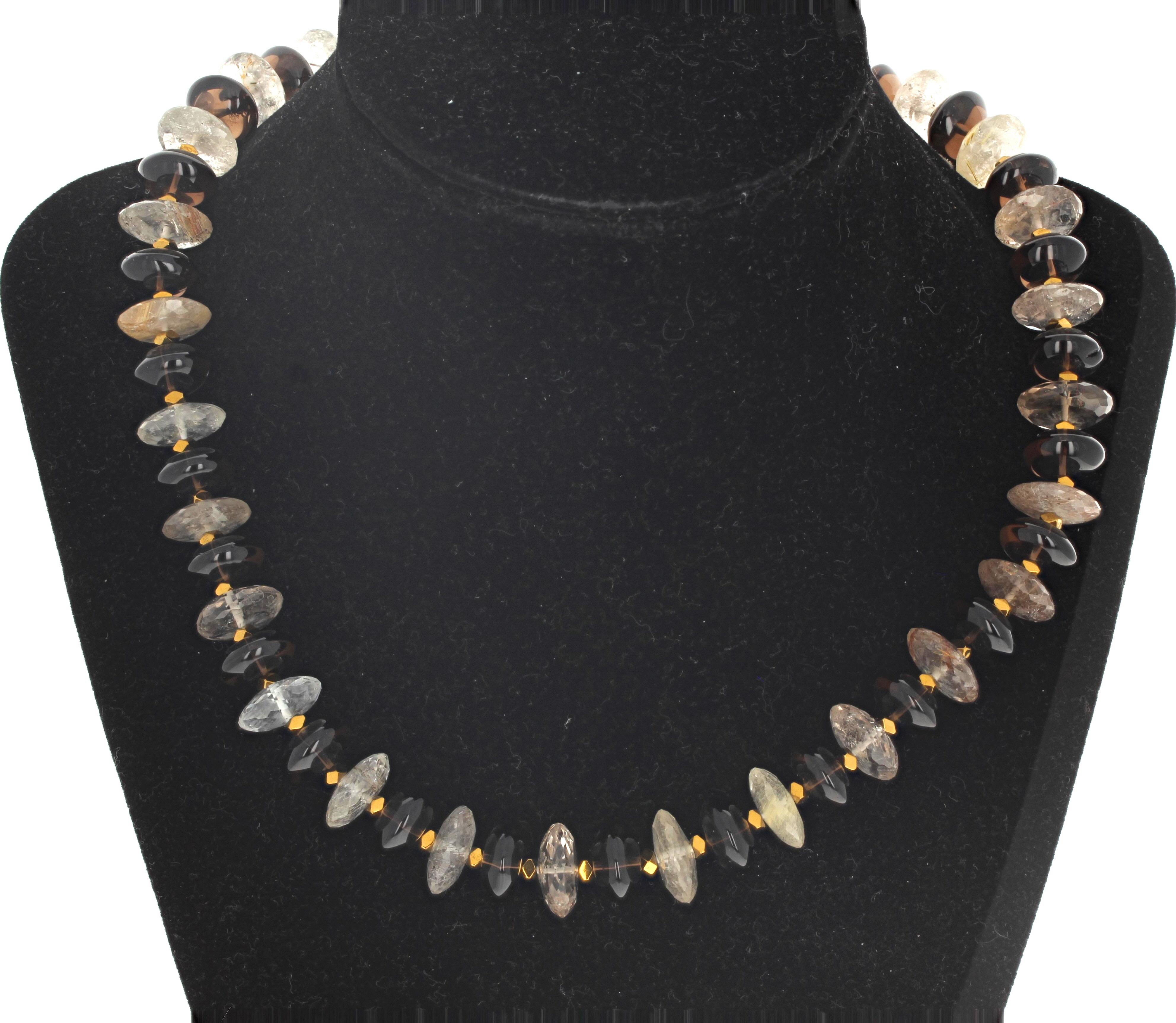 This lovely dinner time necklace is 17 3/4 inches long and glows beautifully when on your neck.  The highly polished natural Smoky Quartz are approximately 12mm and the fascinating real Rutilated Quartz are approximately 14mm.  The clasp is an easy