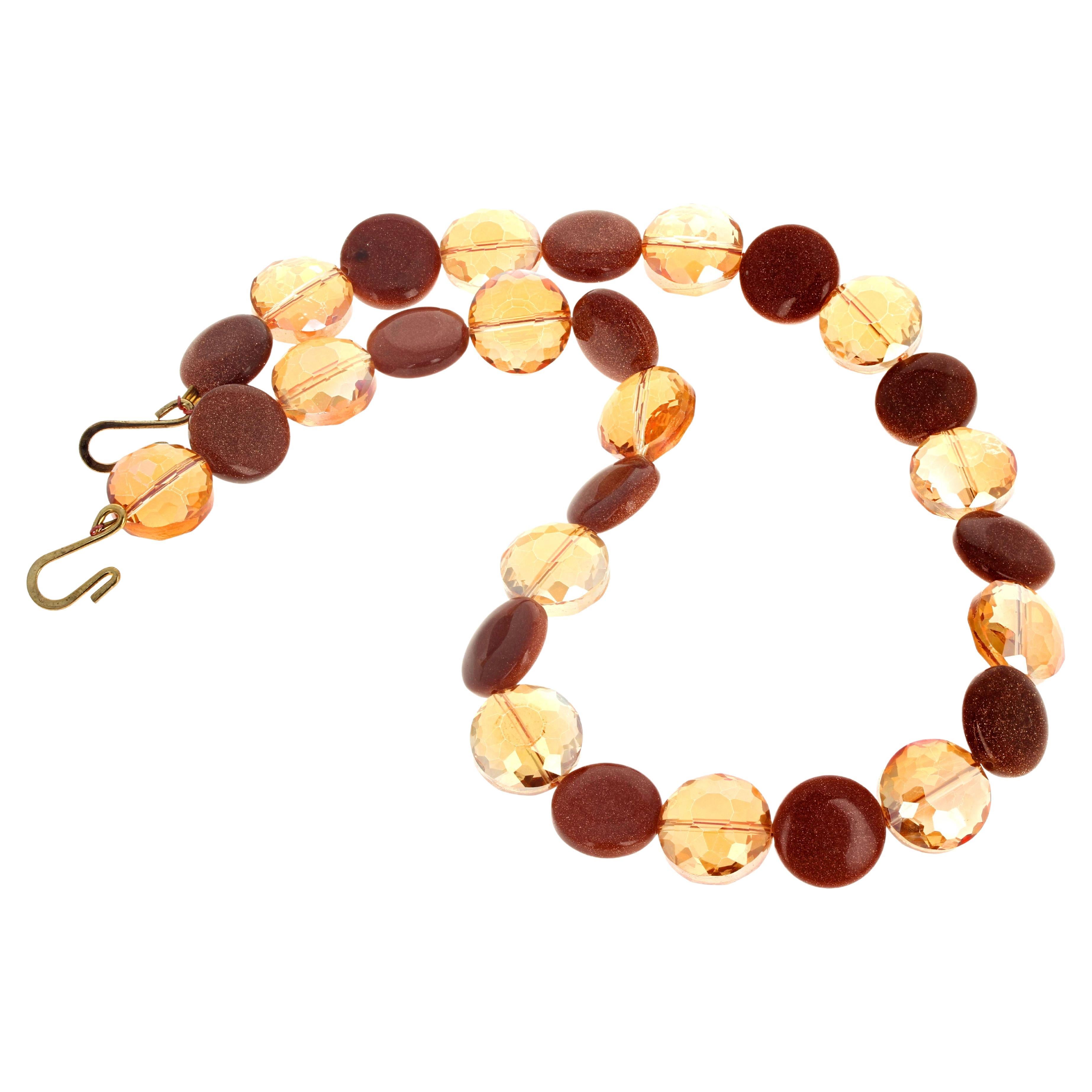The tiny sparkle in the Brown Goldstone is enhanced by the brilliant goldy coated translucent Quartz in the 16 inches long necklace.  They are all 14mm and the clasp is an easy to use gold plated hook clasp.  