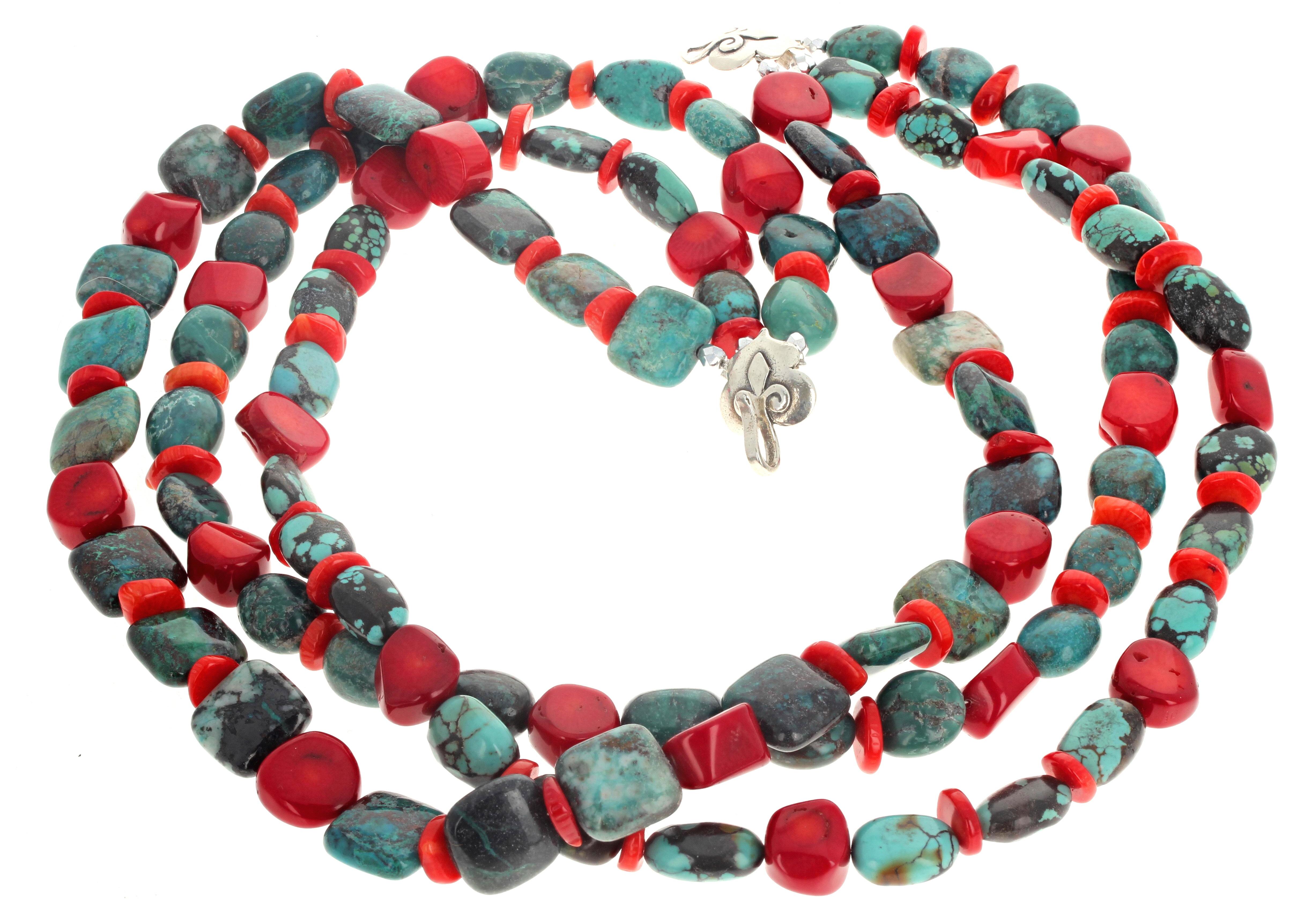 This is a dramatic and superbly elegant 20 inch long triple strand Turquoise and Coral necklace. The Turquoise are approximately 13mm x 13mm.  The larger red Coral are approximately 14mm wide.  The clasp is an elegant sterling silver easy to use