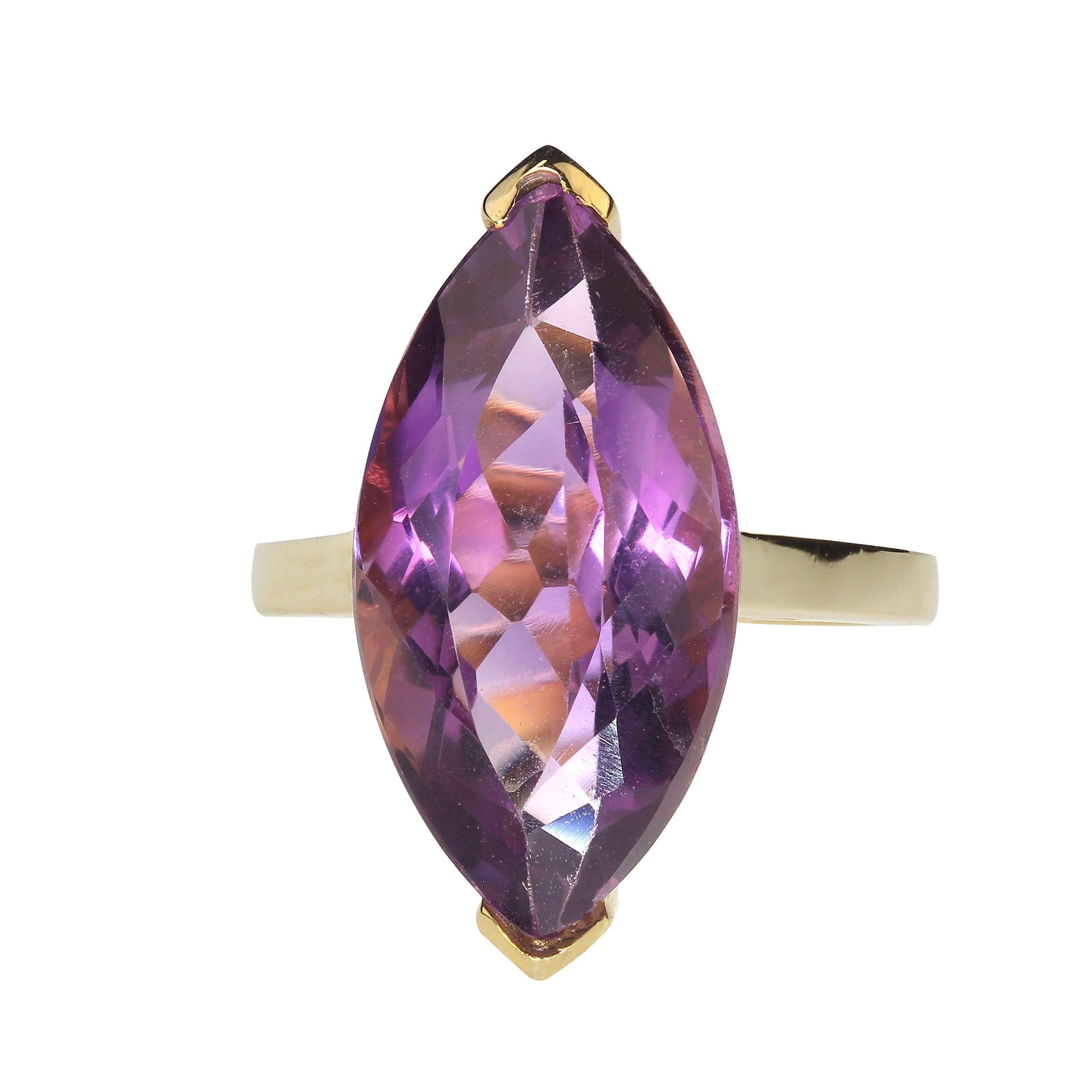 Marvelous marquise shaped 13.71ct Amethyst in gold rhodium over Sterling Silver ring. This lovely amethyst comes to us straight from one of our favorite Brazilian vendors.  It is perfectly set with the end tips protected and the sides open to the
