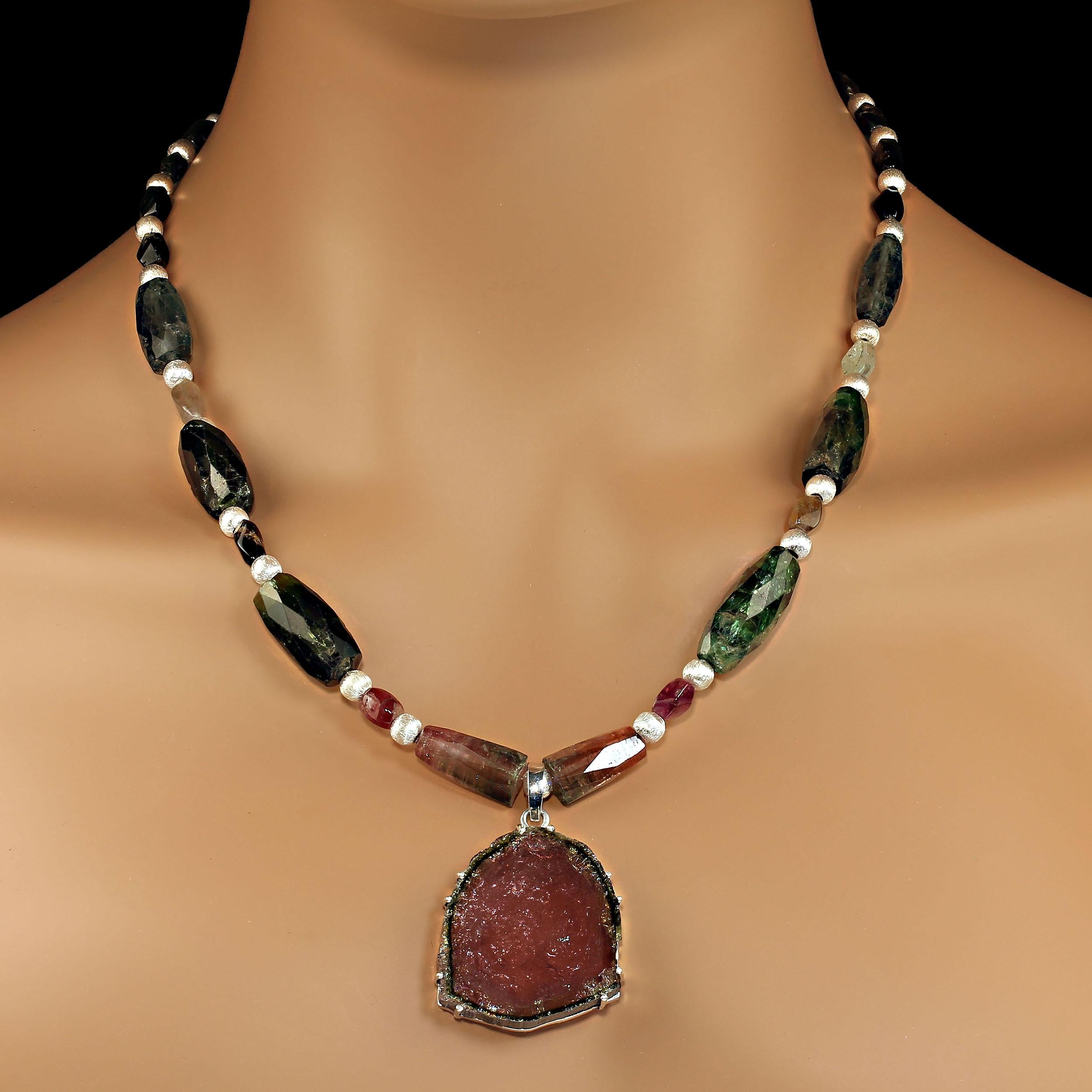 Magnificent multi color tourmaline necklace featuring a 50 carat watermelon tourmaline slice.  This elegant necklace is 20 inches in length.  The tourmaline slice is 50 carats and 30 x 34 MM.  There are matte silver accents between the tourmalines