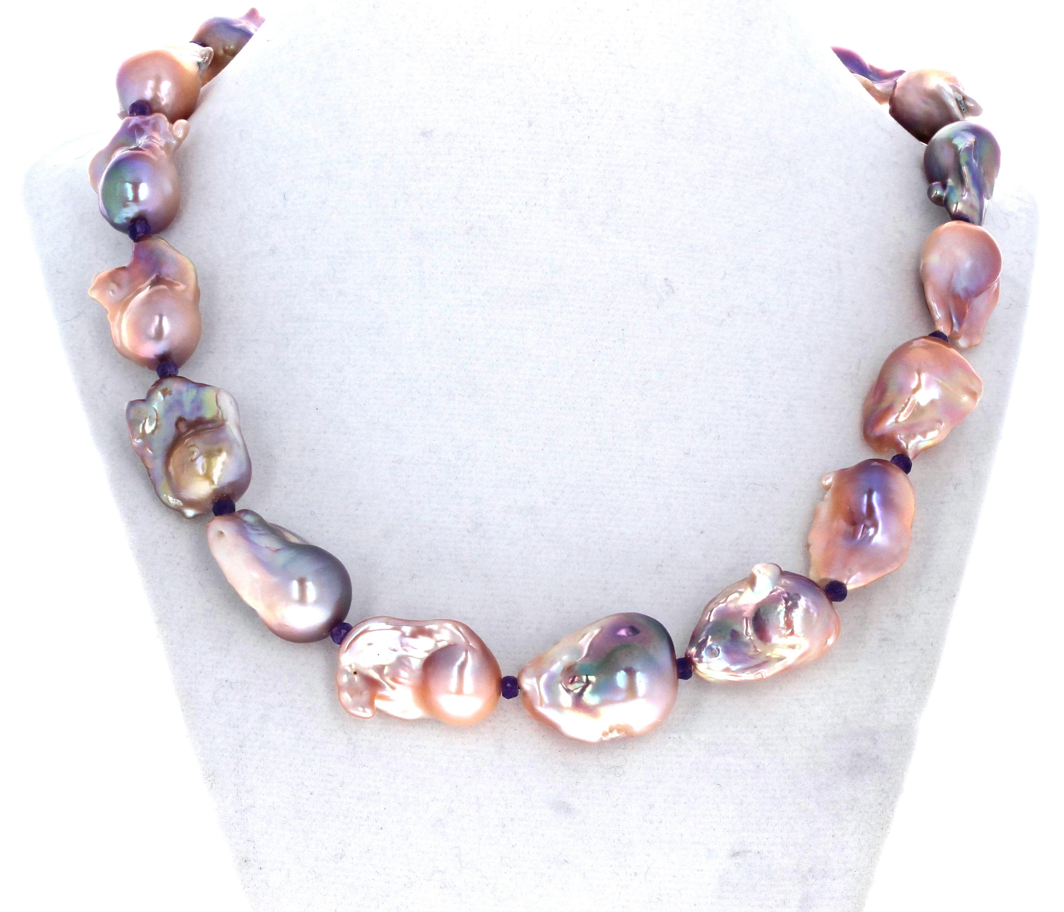 Absolutely magnificent gorgeous natural real pinky and purpley Pearls.  They are enhanced with tiny real little Amethyst gemstones.  The clasp is an easy to use gold plated hook clasp. The largest Pearl is approximately 20mm x 25mm..  