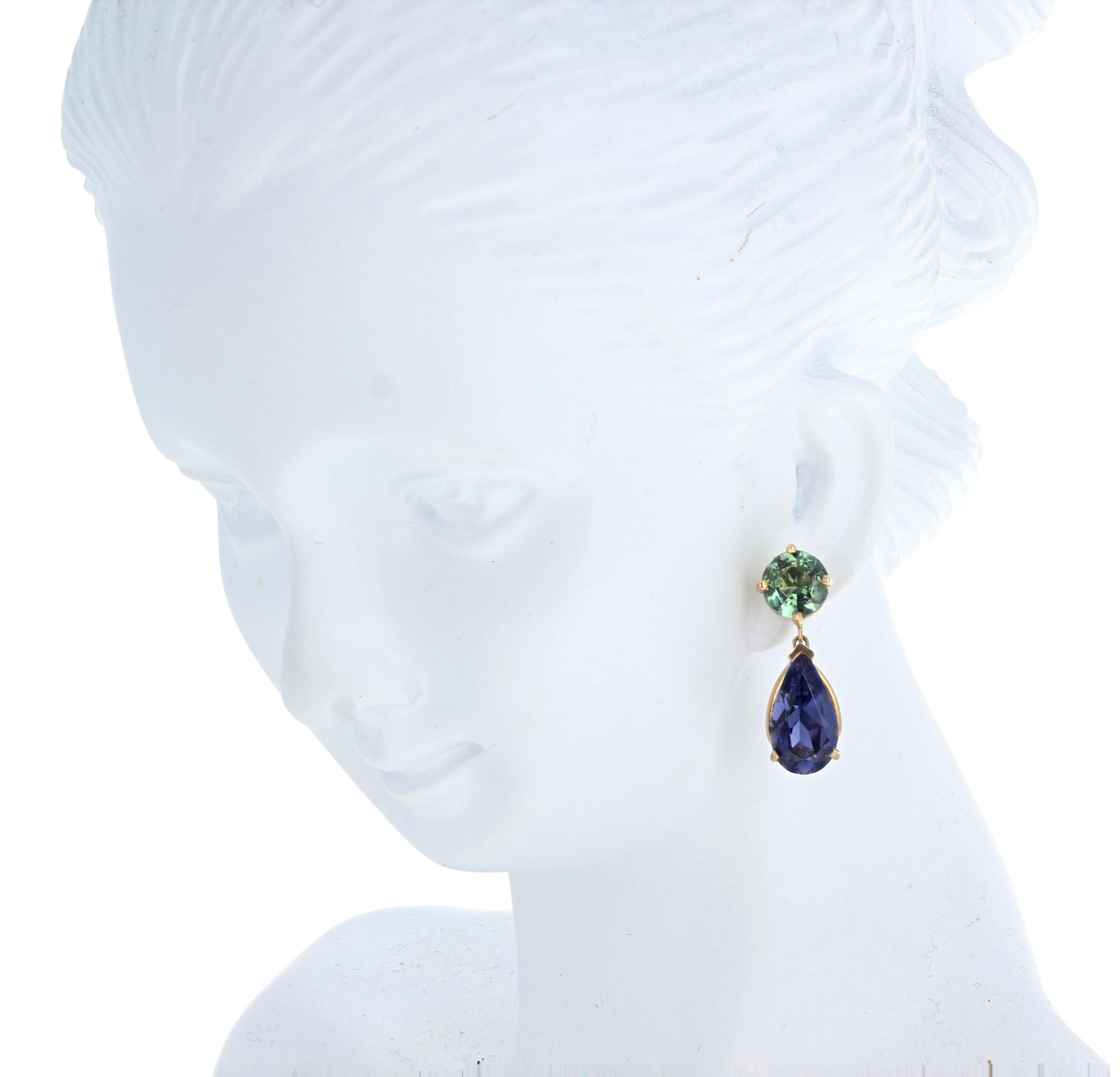 These brilliant round green Tourmalines (6mm) enhance the fascinating intensely blue glittery natural Iolites (10mm x 6 1/2mm) in these 14Kt yellow gold stud earrings.  The total dangle length of these beautiful earrings is 18 1/2mm.  